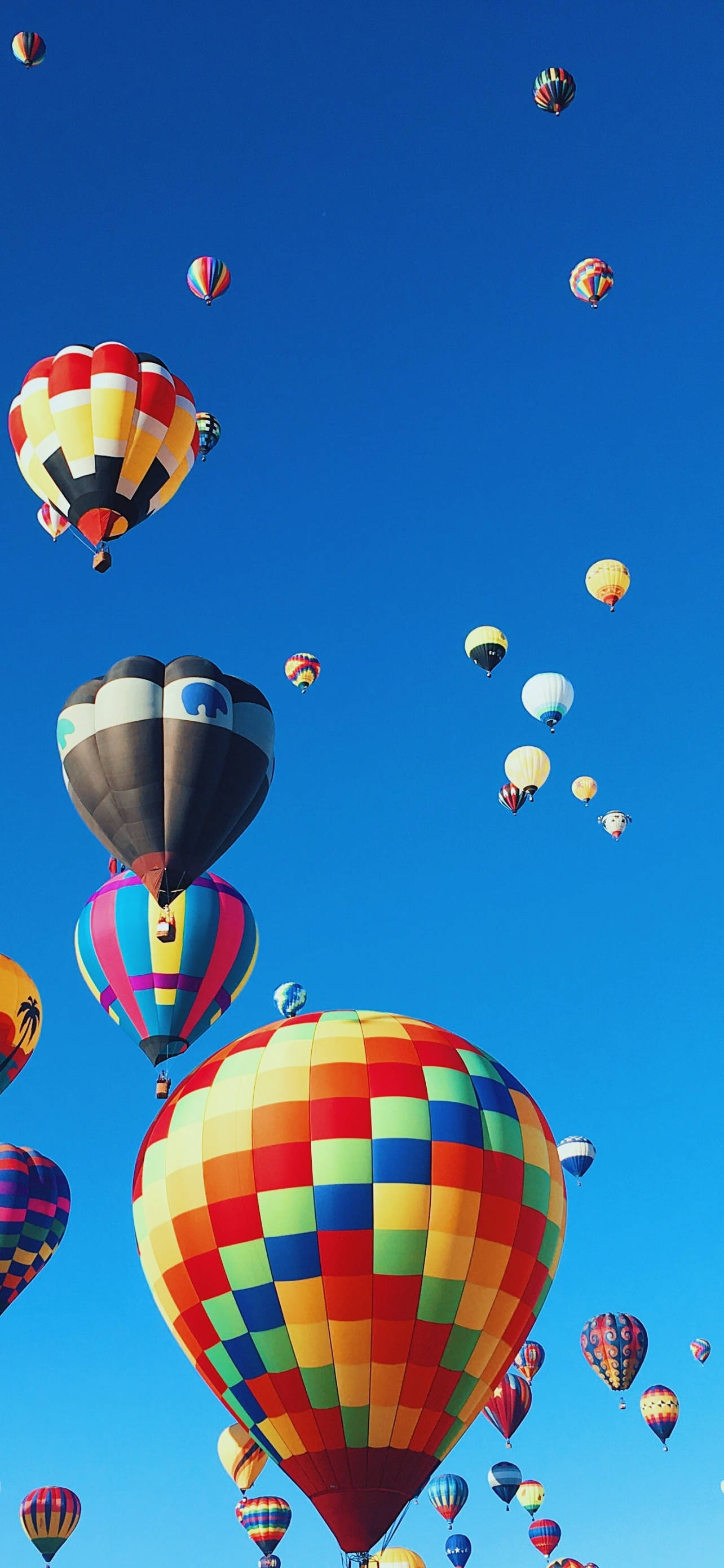 hot air balloon, rainbow patterns, clear blue sky, 2K Phone Wallpaper