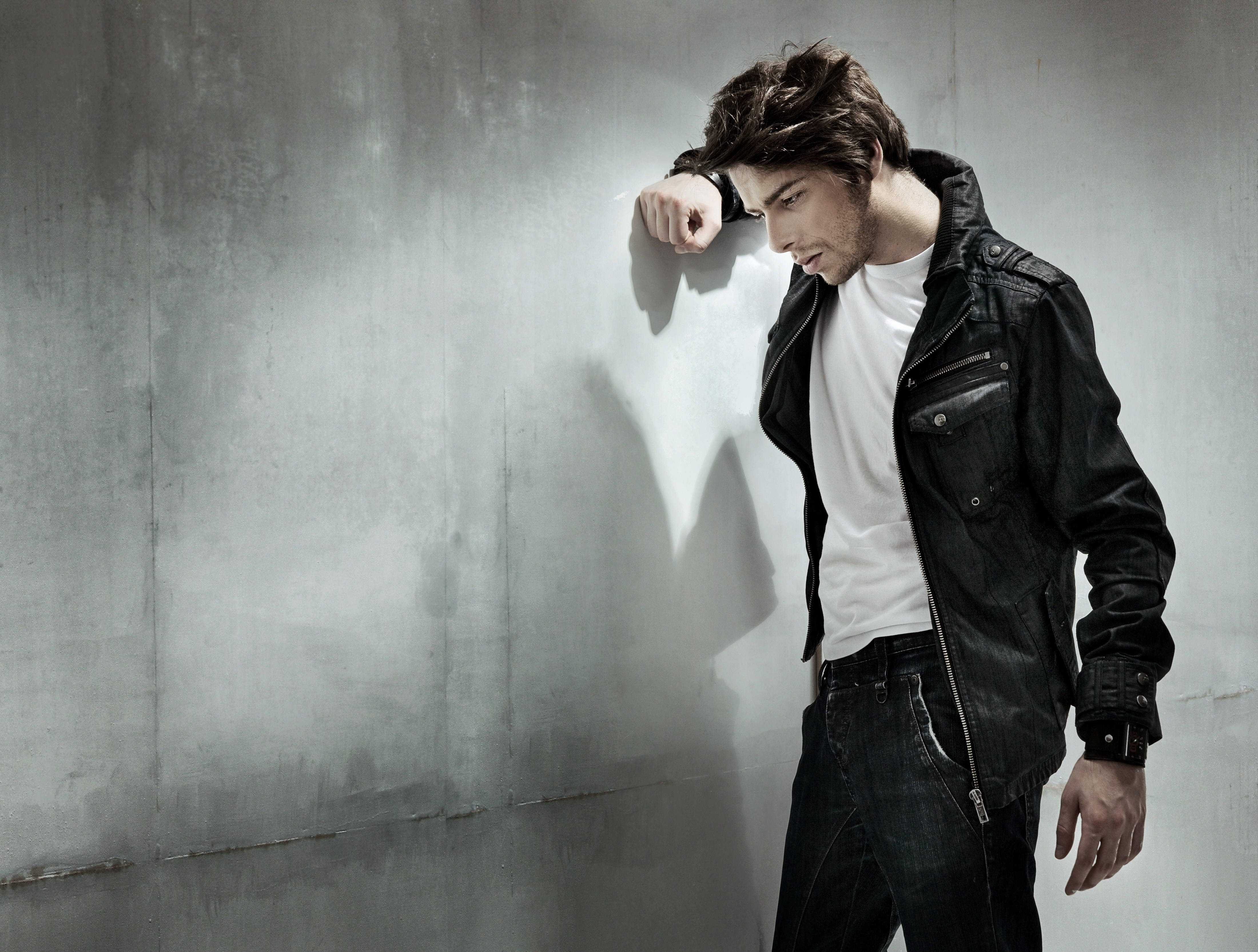 black leather jacket, textured concrete wall, sharp shadow, 4K Desktop Wallpaper