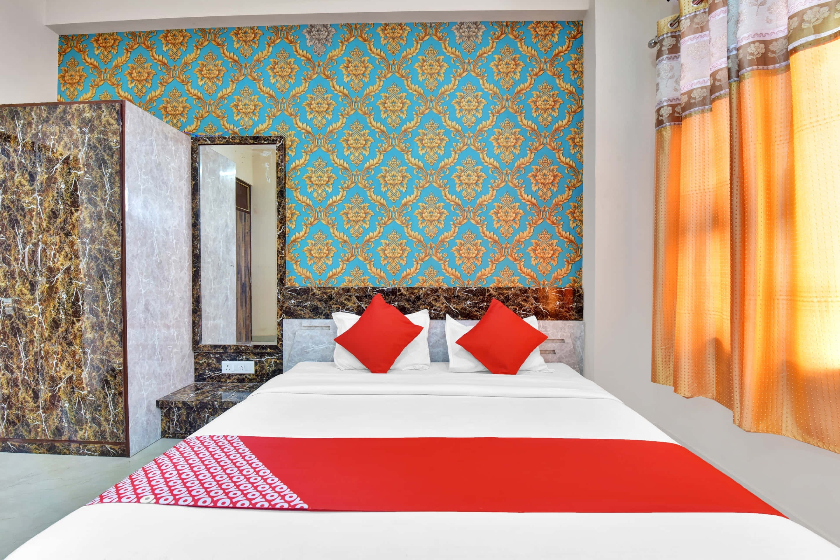 simple double bed hotel room, cozy contemporary hotel room, red pillows, 2K Desktop Wallpaper