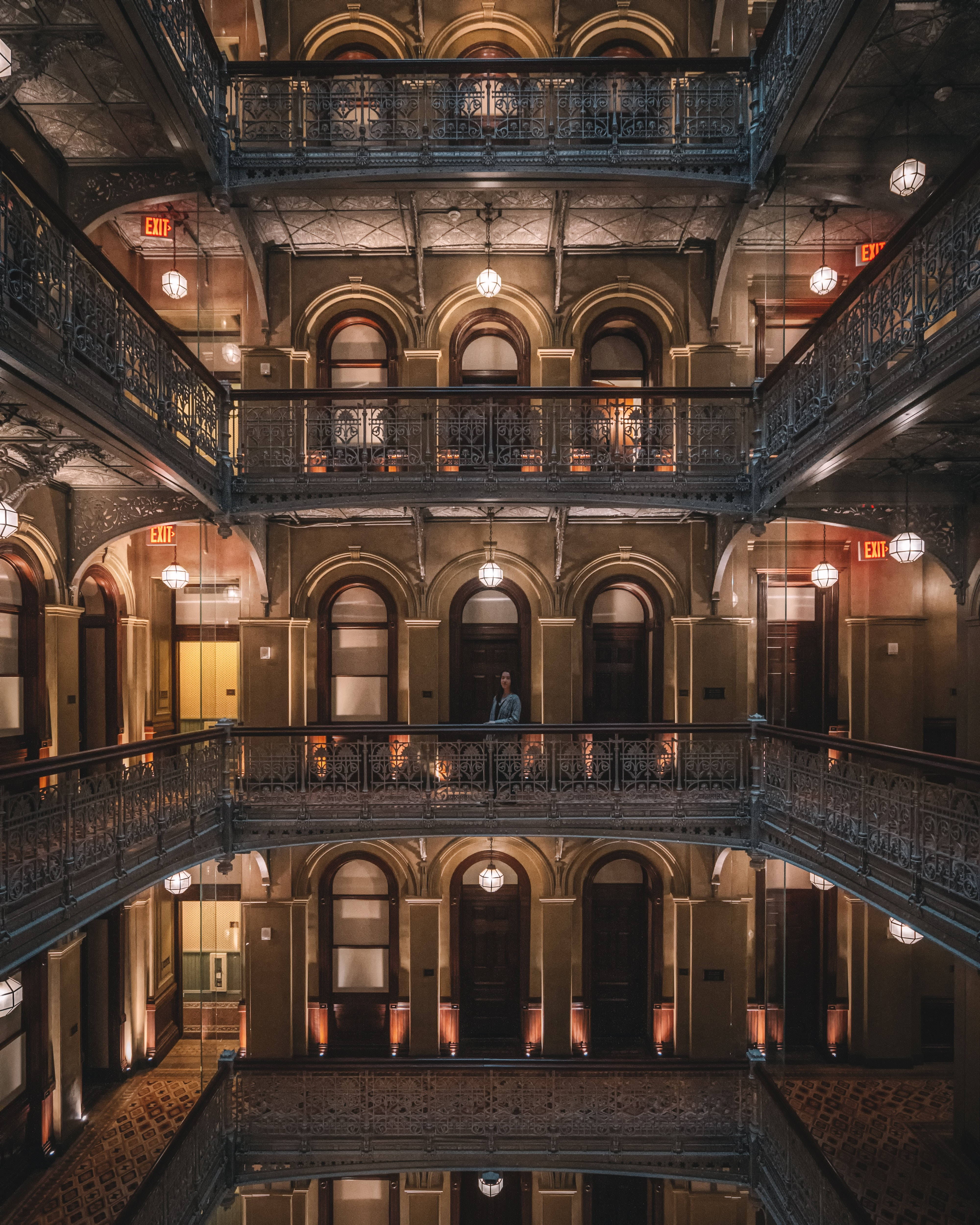 ornate balcony, grand, multi-level hotel atrium, warm hanging lights, 4K Phone Wallpaper