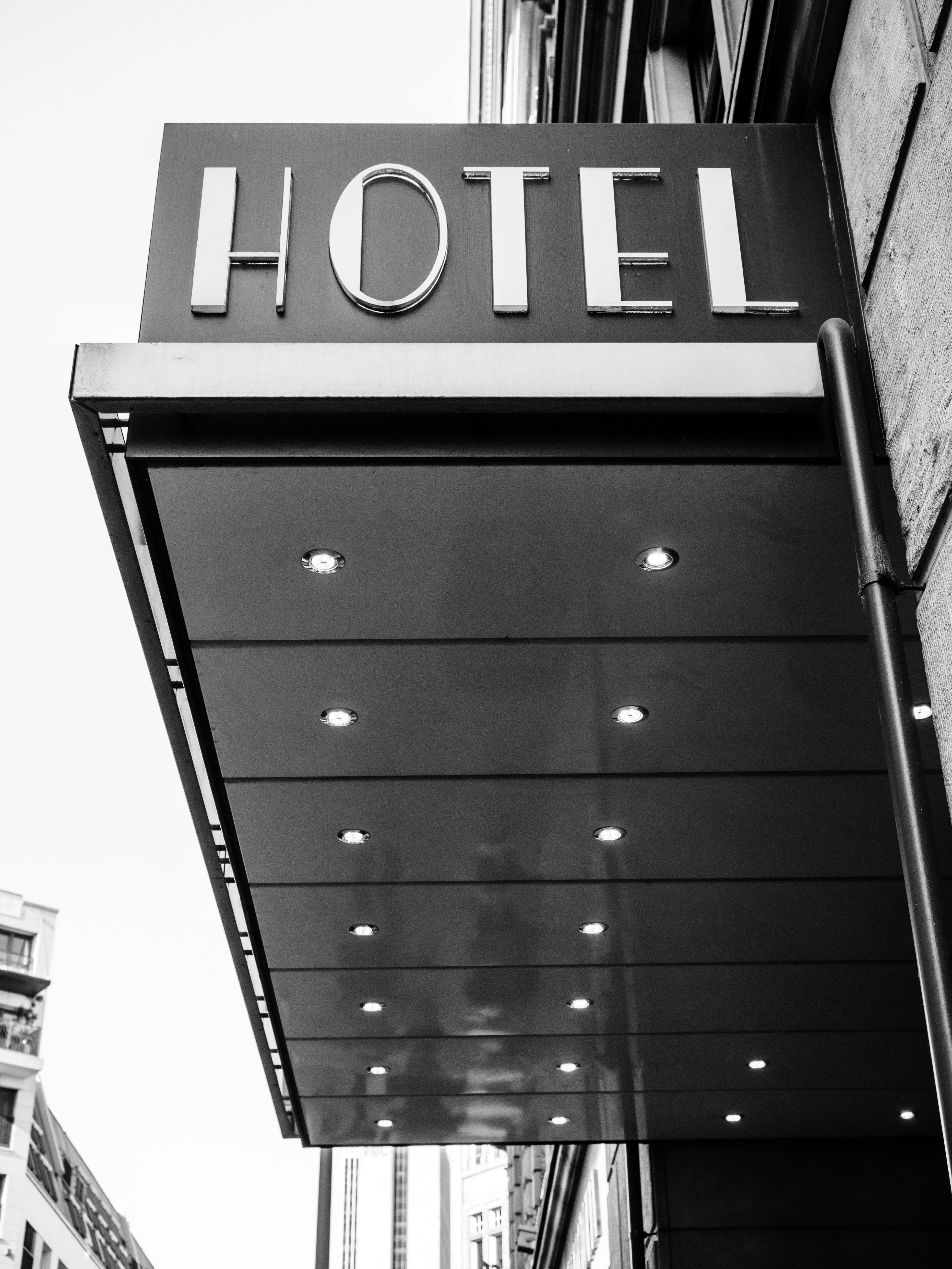 grayscale hotel sign, modern hotel sign, embedded lights, 5K Phone Wallpaper