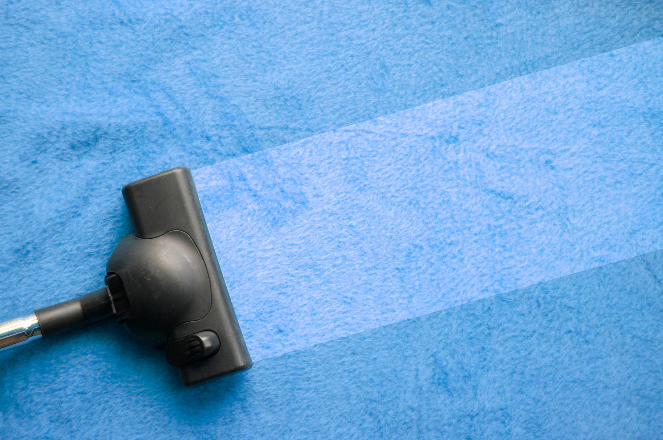 black vacuum cleaner nozzle, vibrant blue textured carpet, clean path, Full HD Desktop Wallpaper