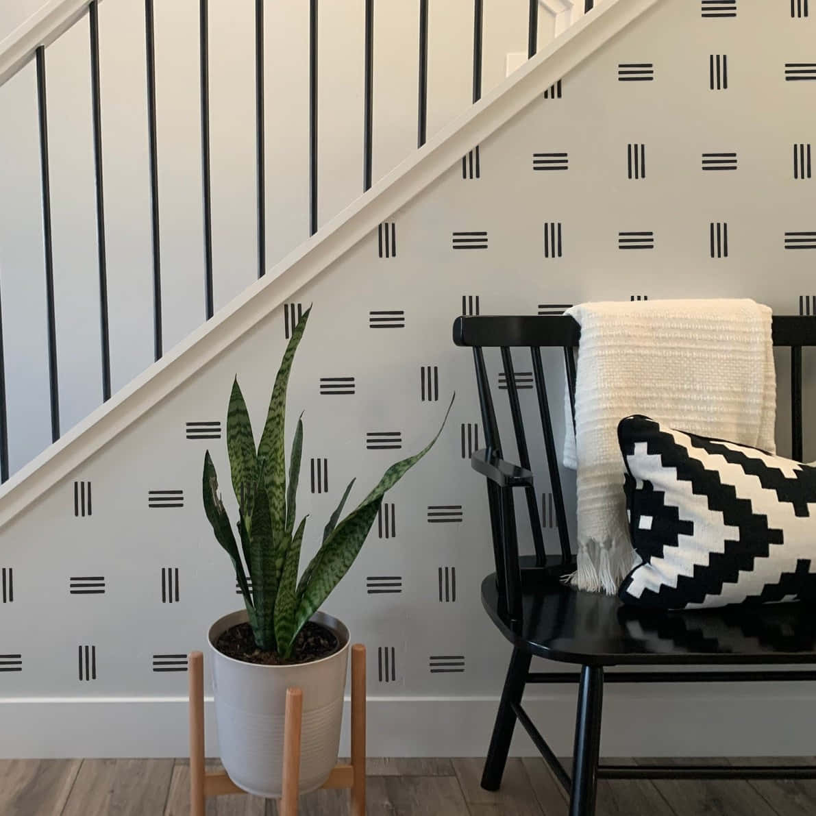 modern minimalist sitting area, black chair, patterned wallpaper, SD Desktop Wallpaper