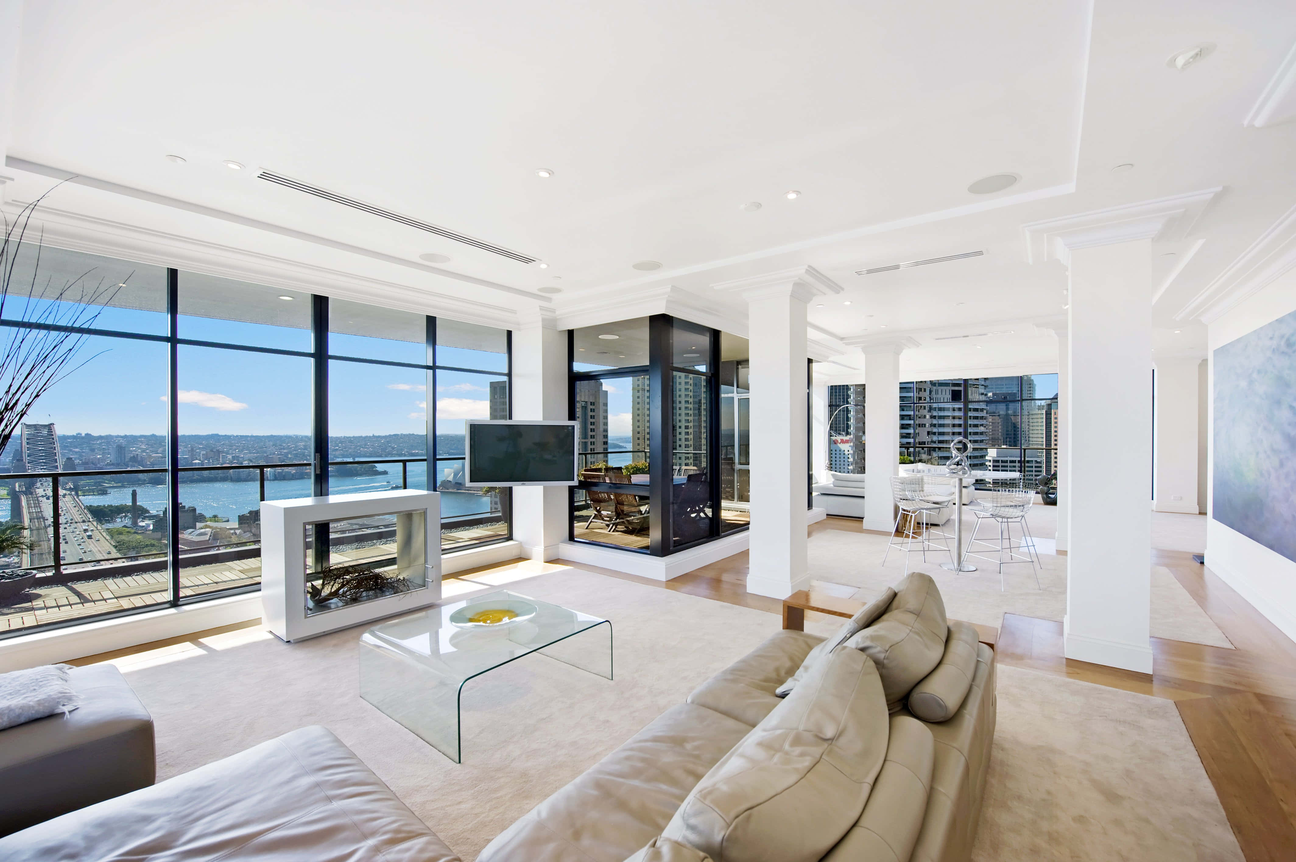 white living room, floor-to-ceiling windows, cityscape, 4K Desktop Wallpaper