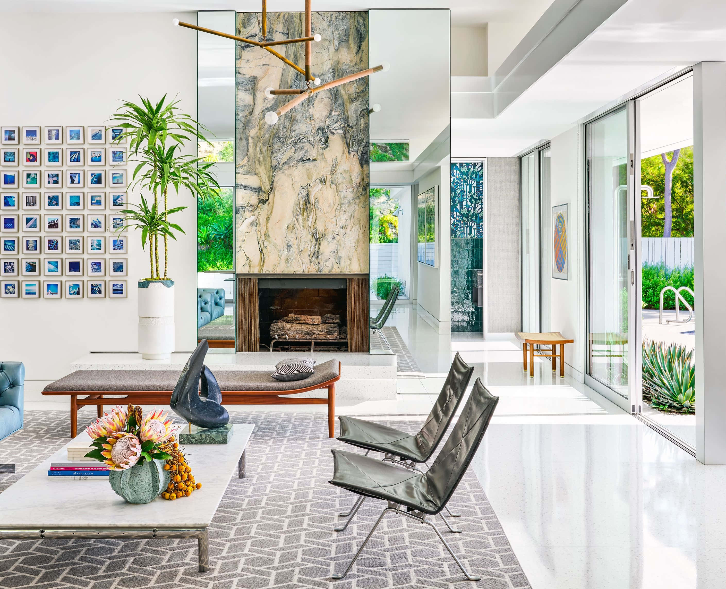 modern living room, marble fireplace, glass doors to a pool, 2K Desktop Wallpaper