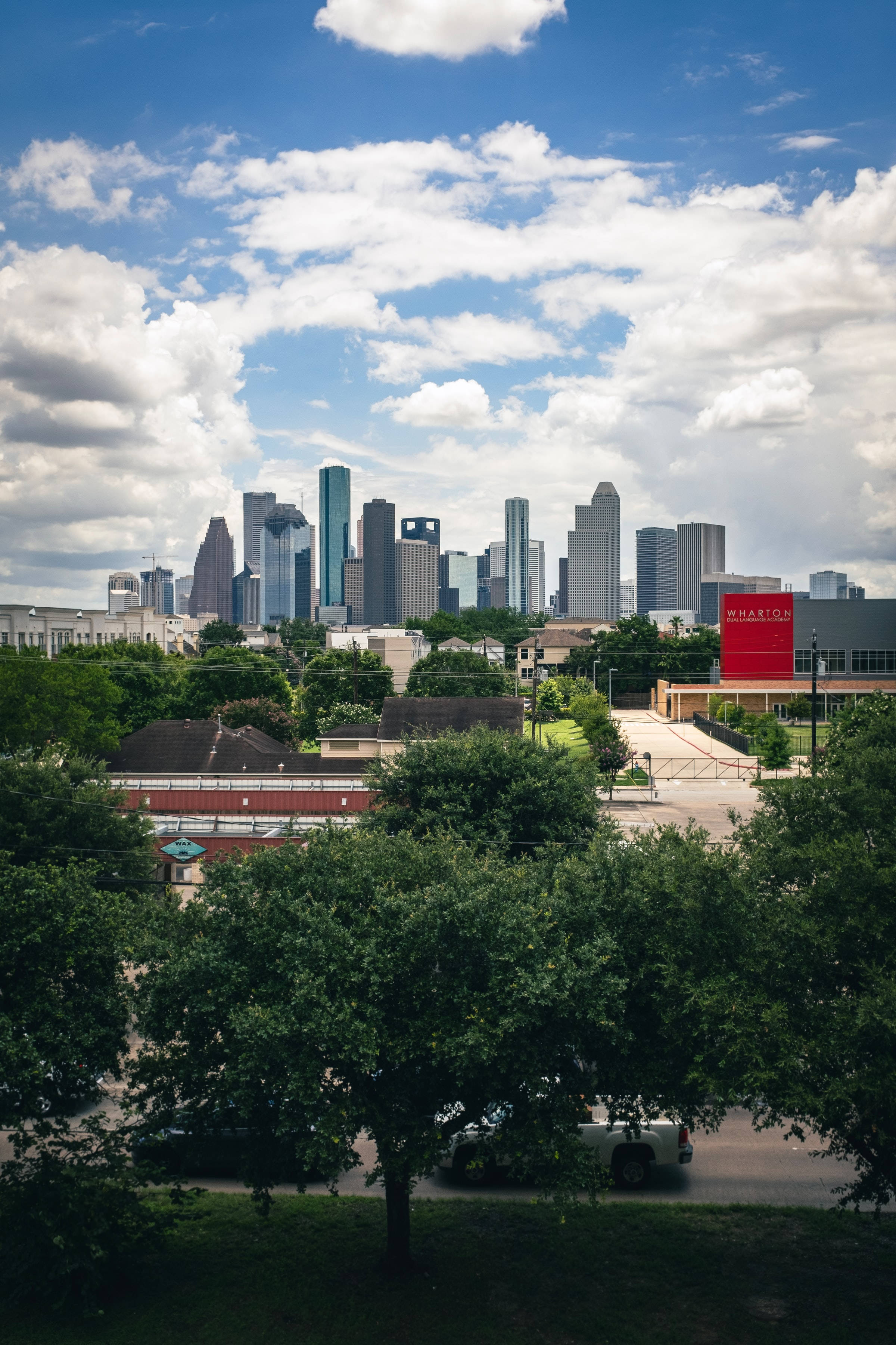 Houston, skyscrapers, lush green trees, 2K Phone Wallpaper