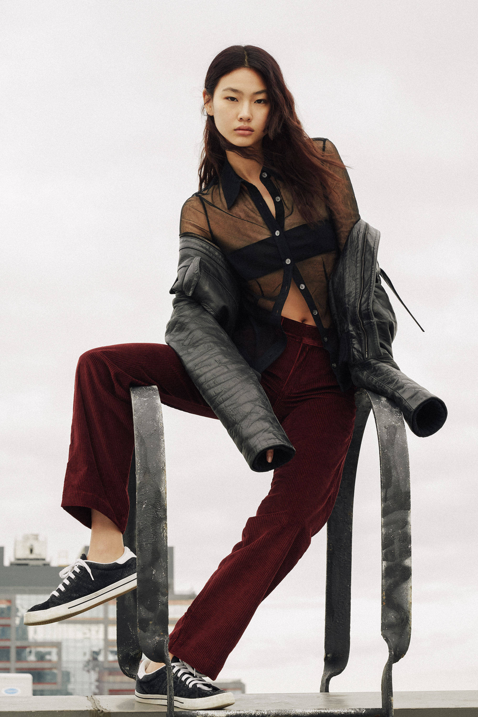 Hoyeon Jung, layered sheer black and burgundy outfit, rooftop railing, 2K Phone Wallpaper