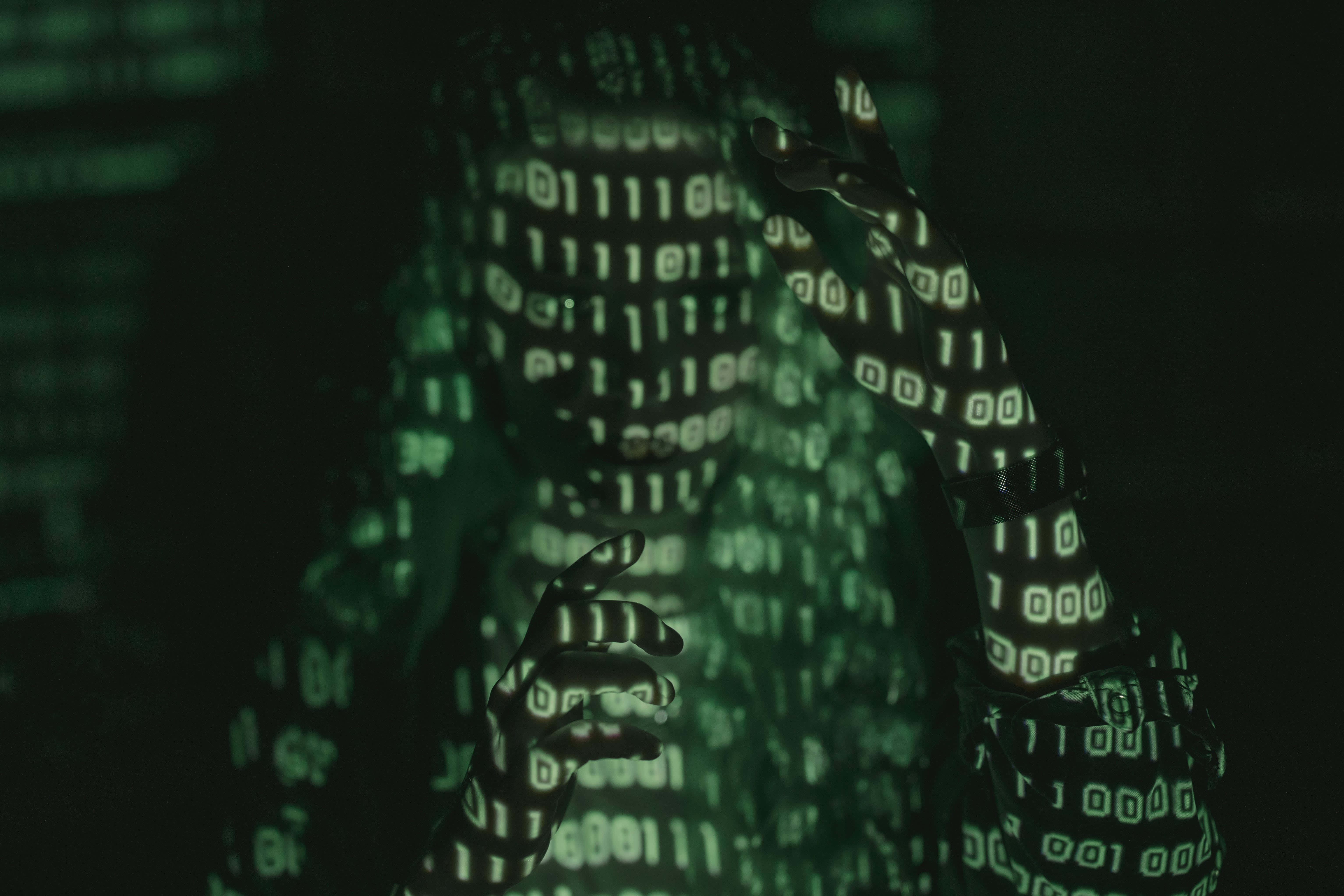 digital code, glowing green binary code, shadowy figure, 5K Desktop Wallpaper