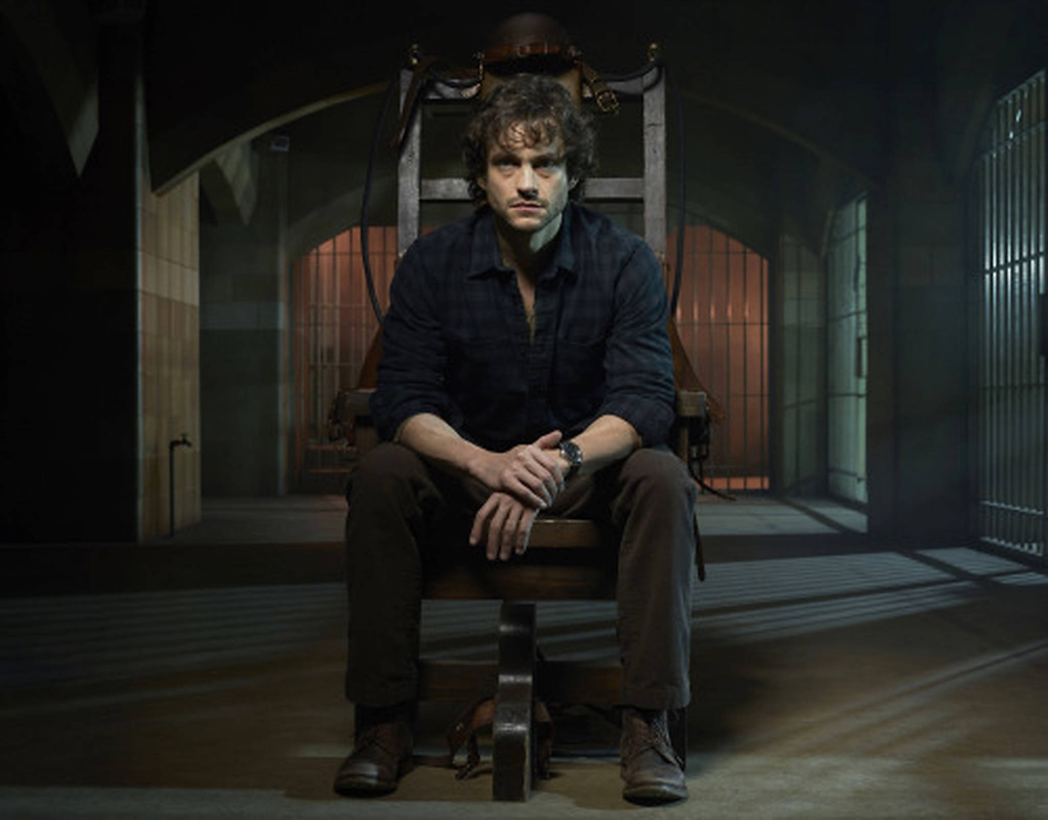 Hugh Dancy, wooden electric chair, dimly lit prison corridor, Full HD Desktop Wallpaper