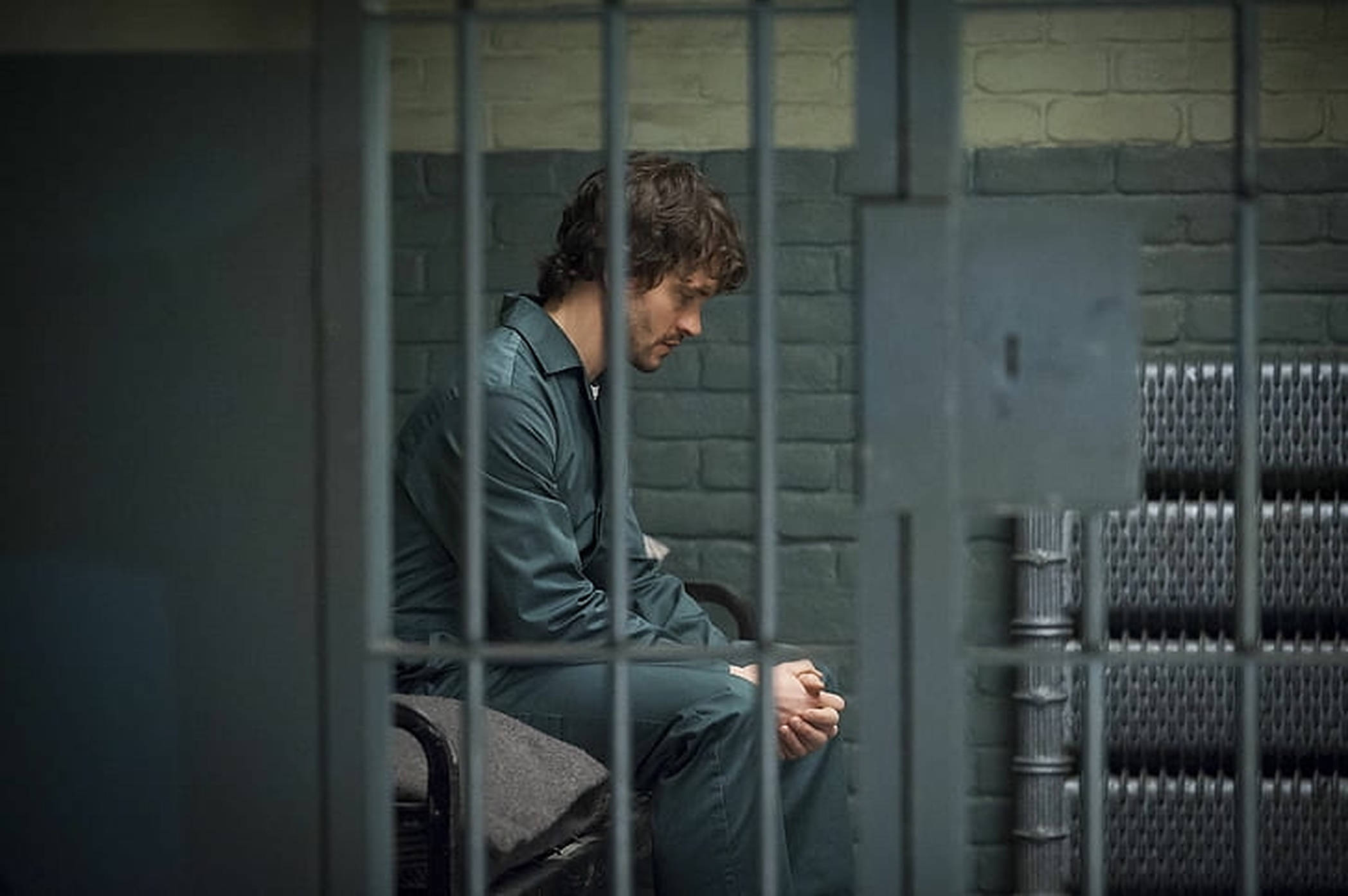 Hugh Dancy, green prison uniform, heavy metal bars, Full HD Desktop Wallpaper