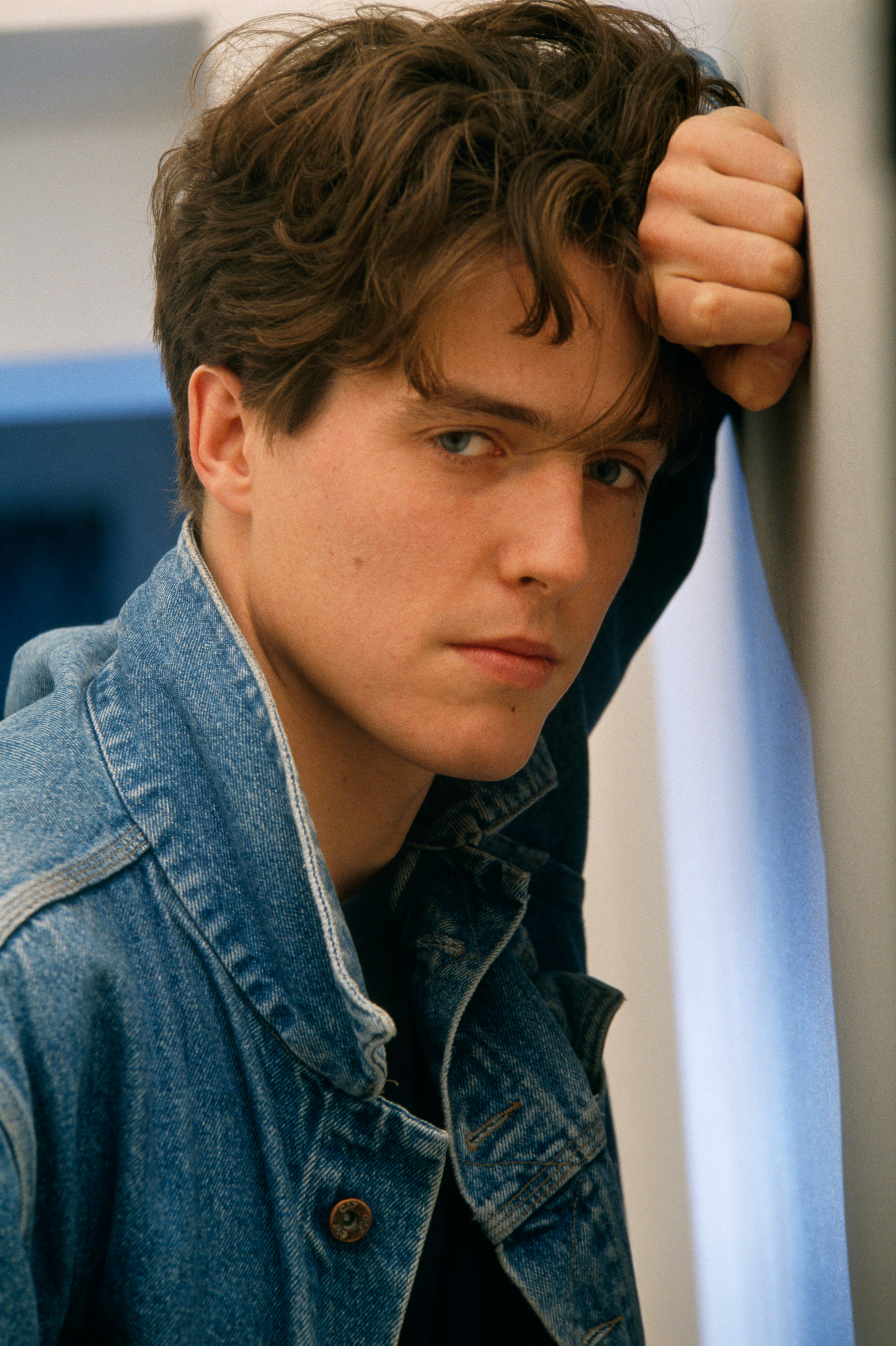 Hugh Grant, denim jacket, tousled brown hair, 5K Phone Wallpaper