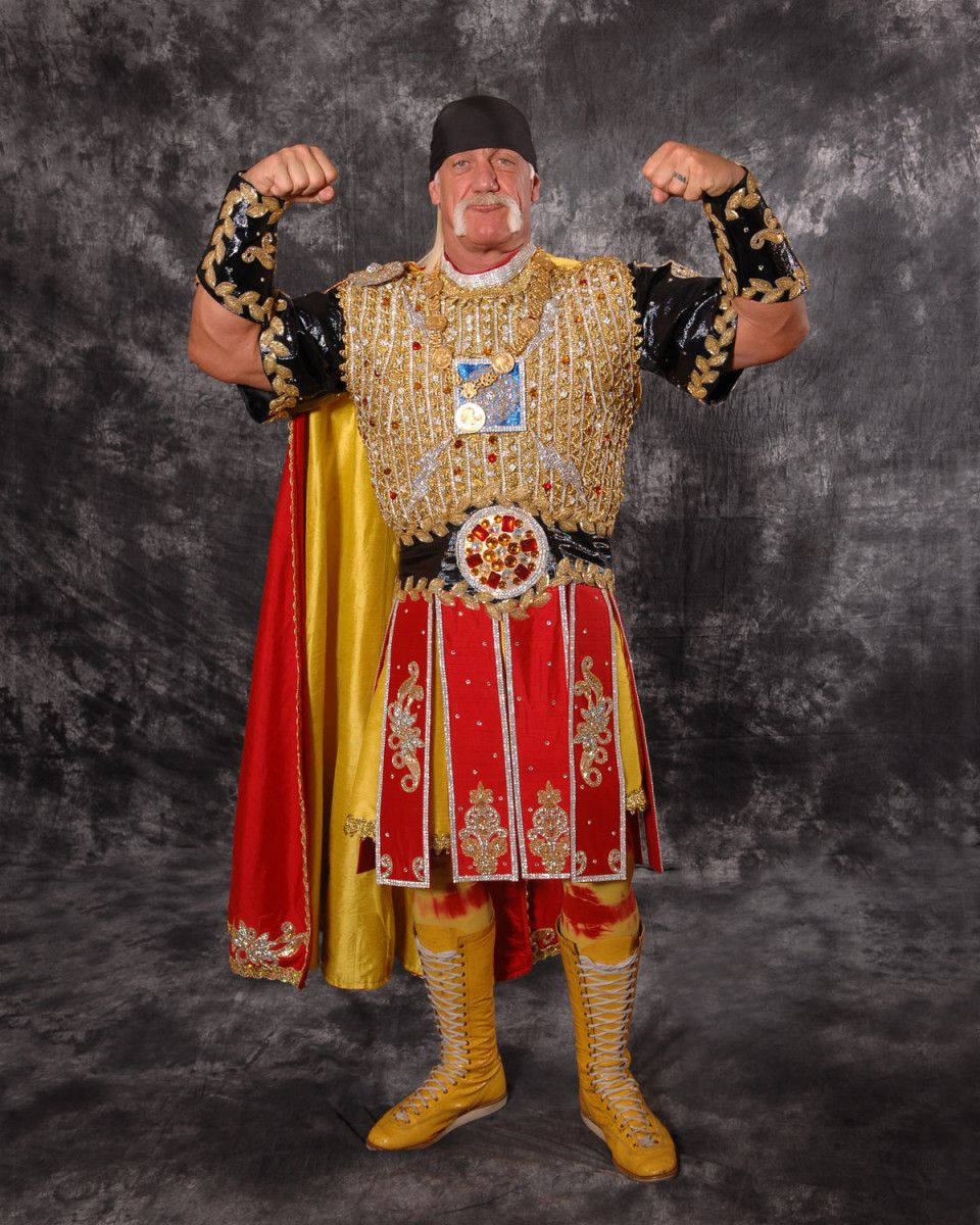 Hulk Hogan, gold and red gladiator costume, dark gray studio backdrop, SD Phone Wallpaper