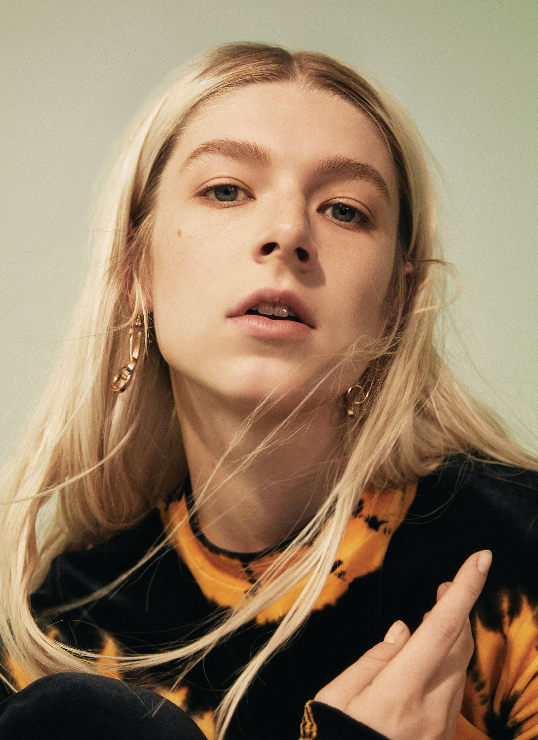 Hunter Schafer, gold hoop earrings, black and orange tie-dye top, Full HD Phone Wallpaper
