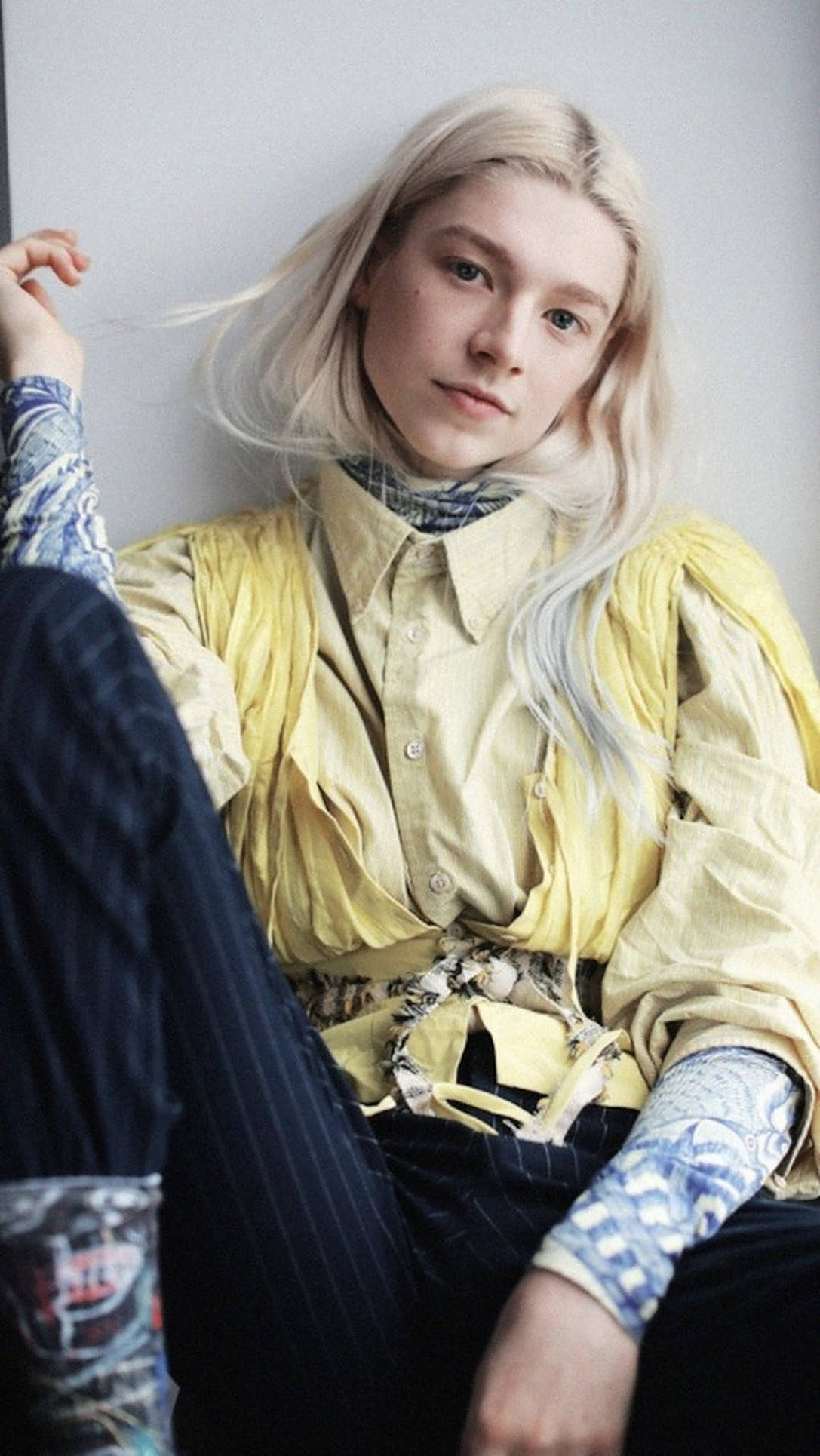 Hunter Schafer, platinum blonde hair, layered yellow shirt, Full HD Phone Wallpaper