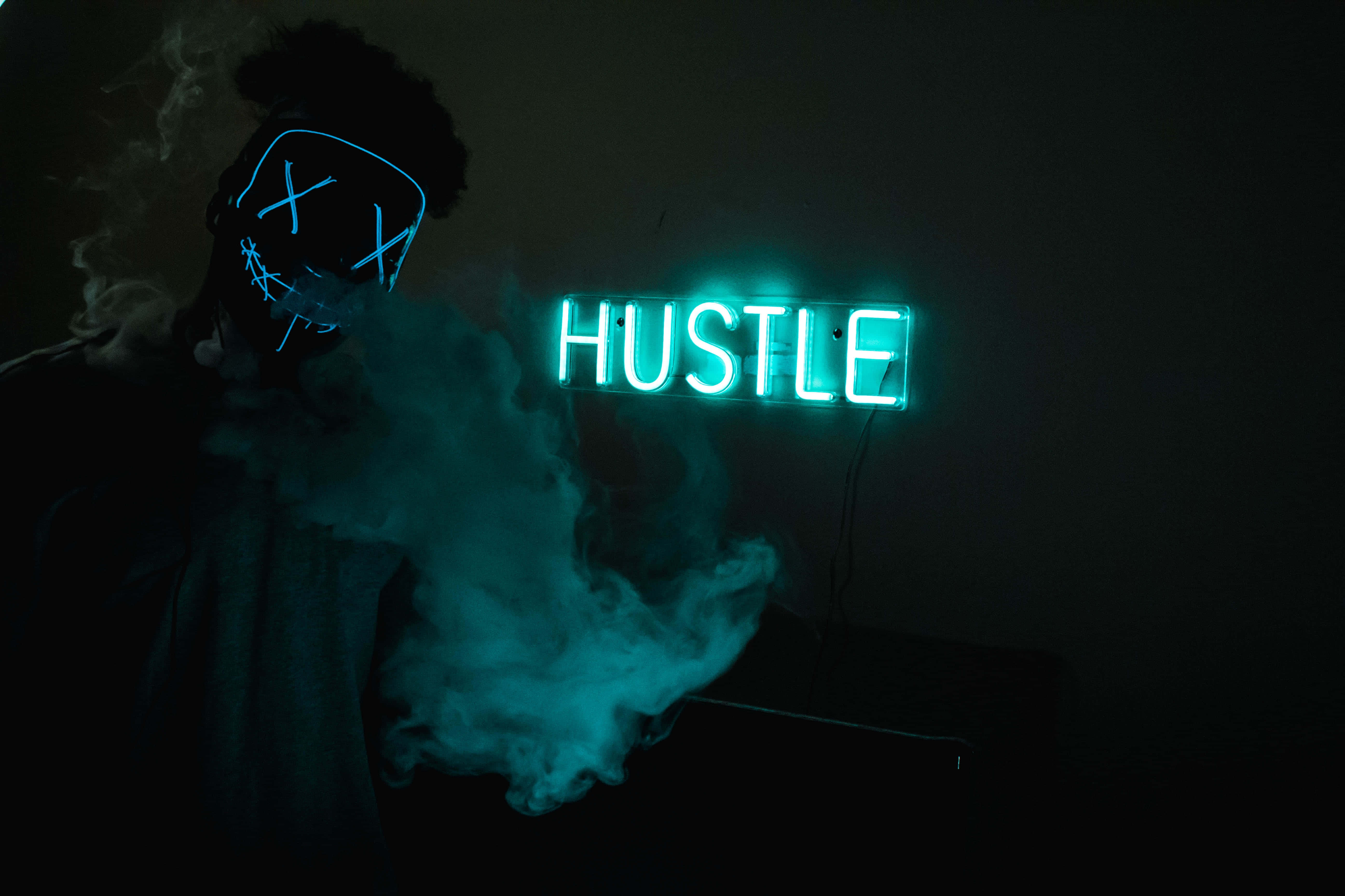 HUSTLE, glowing blue mask, bright teal neon sign, 5K Desktop Wallpaper