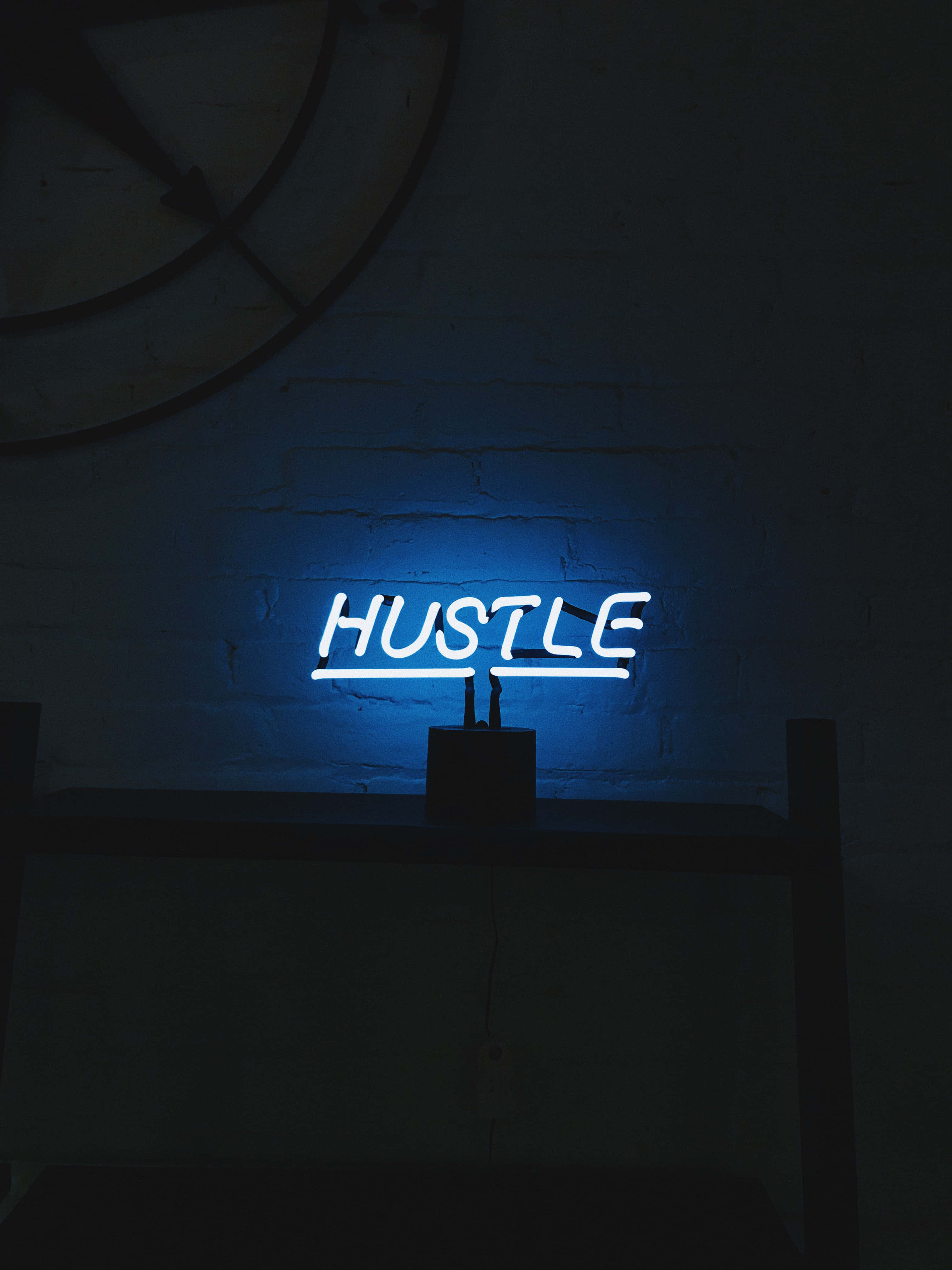 HUSTLE, blue neon sign, dark brick wall, 4K Phone Wallpaper