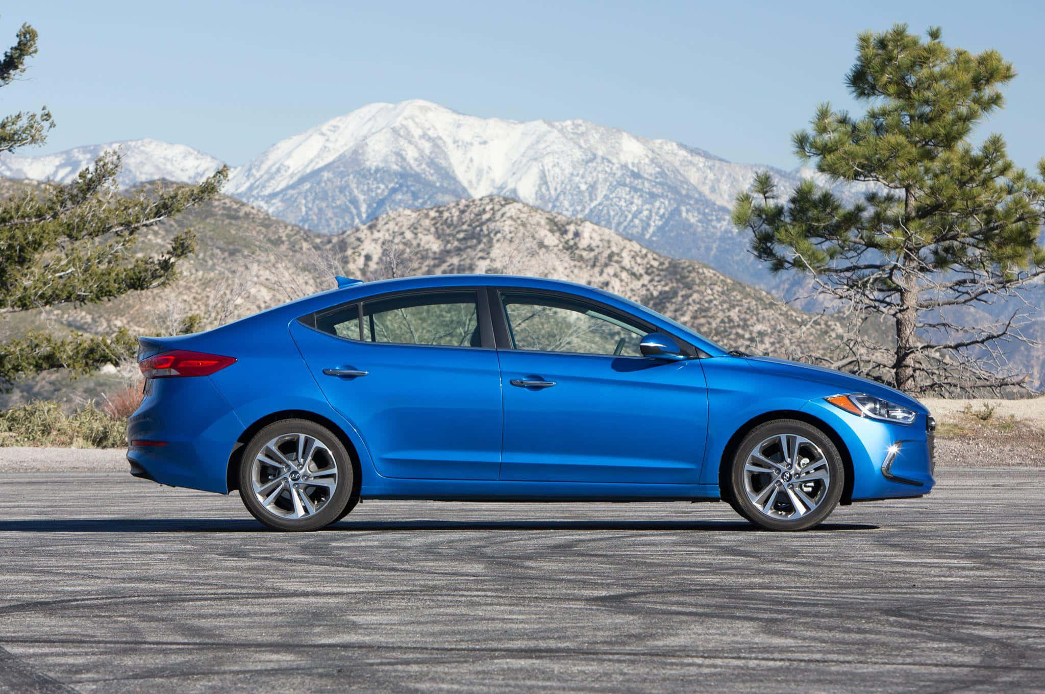 Hyundai Elantra, vibrant blue sedan, paved road, Full HD Desktop Wallpaper