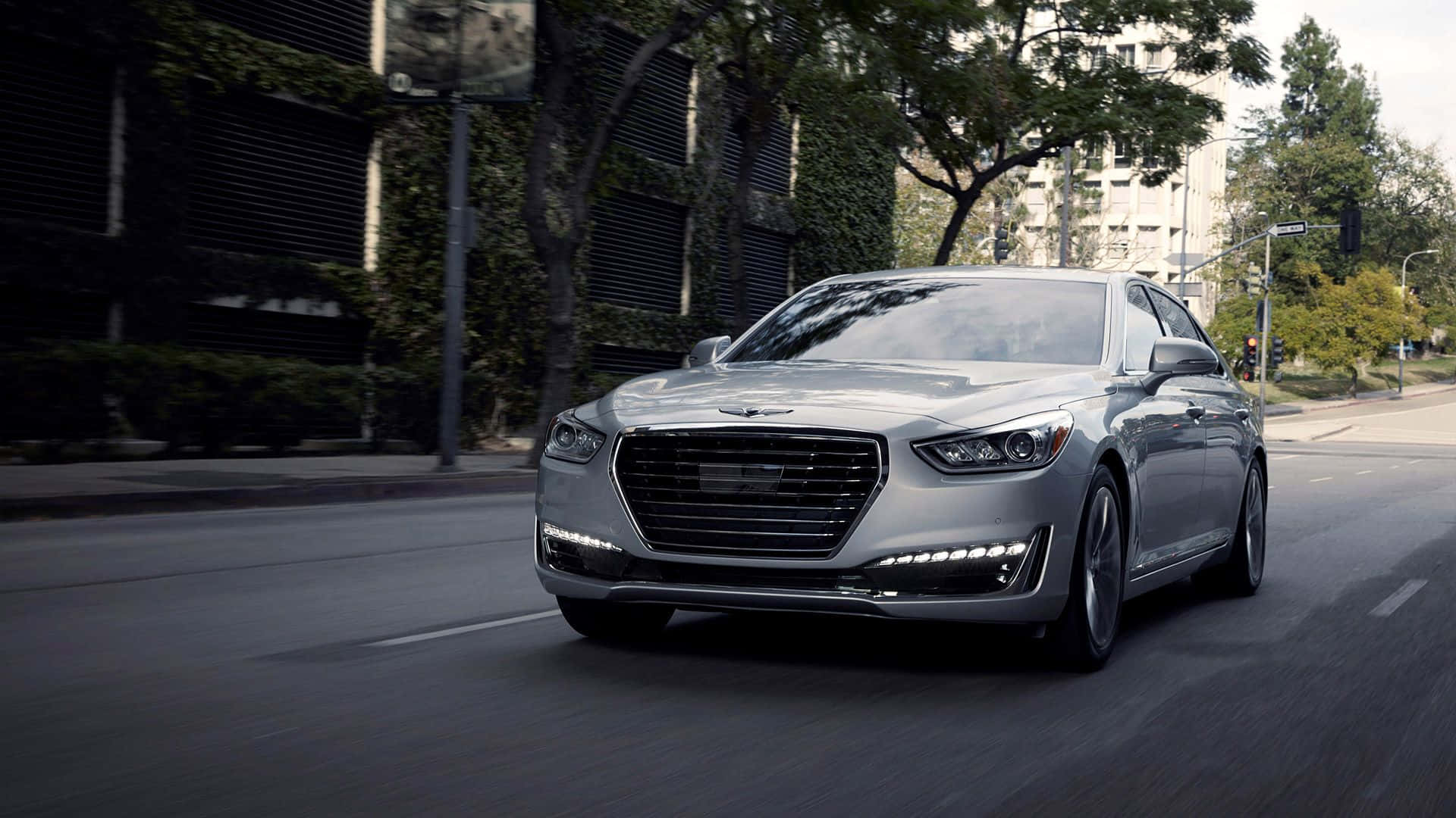 Hyundai Genesis, sleek silver luxury sedan, tree-lined urban street, Full HD Desktop Wallpaper