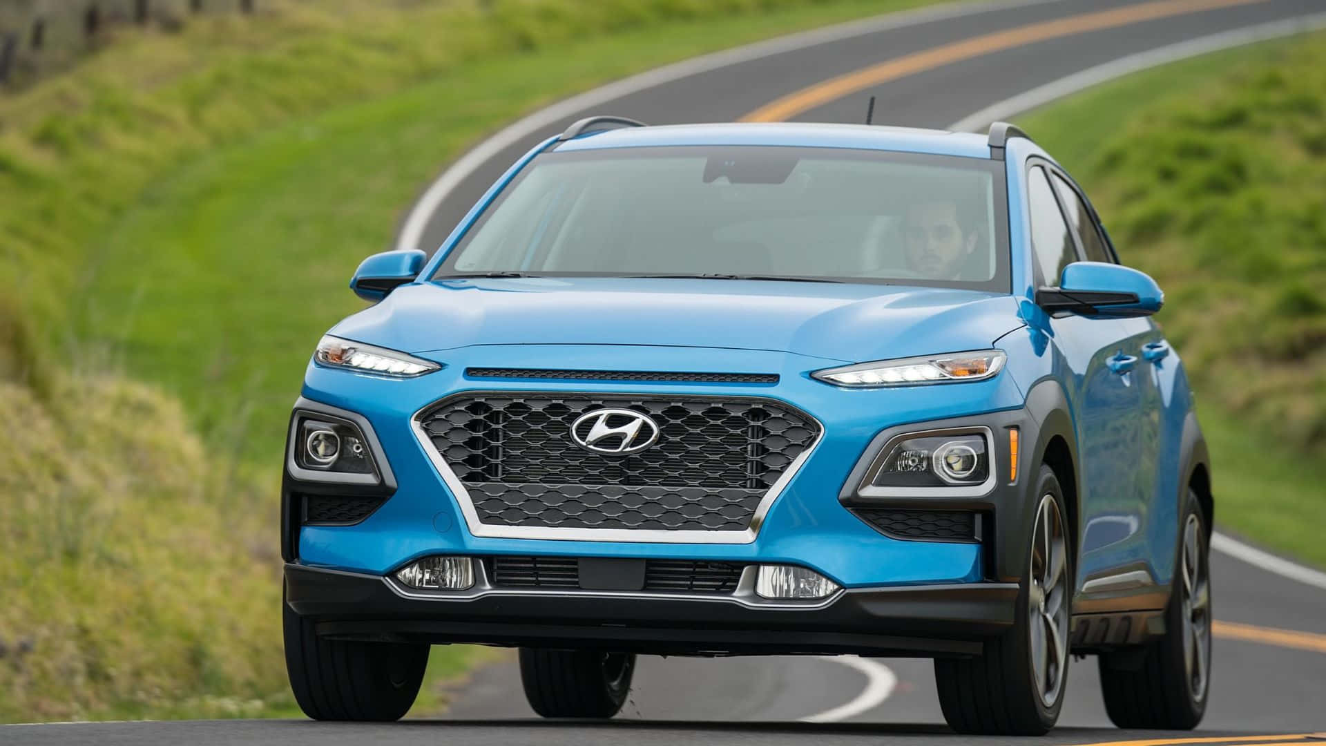 Hyundai Kona, vibrant blue, winding asphalt road, Full HD Desktop Wallpaper