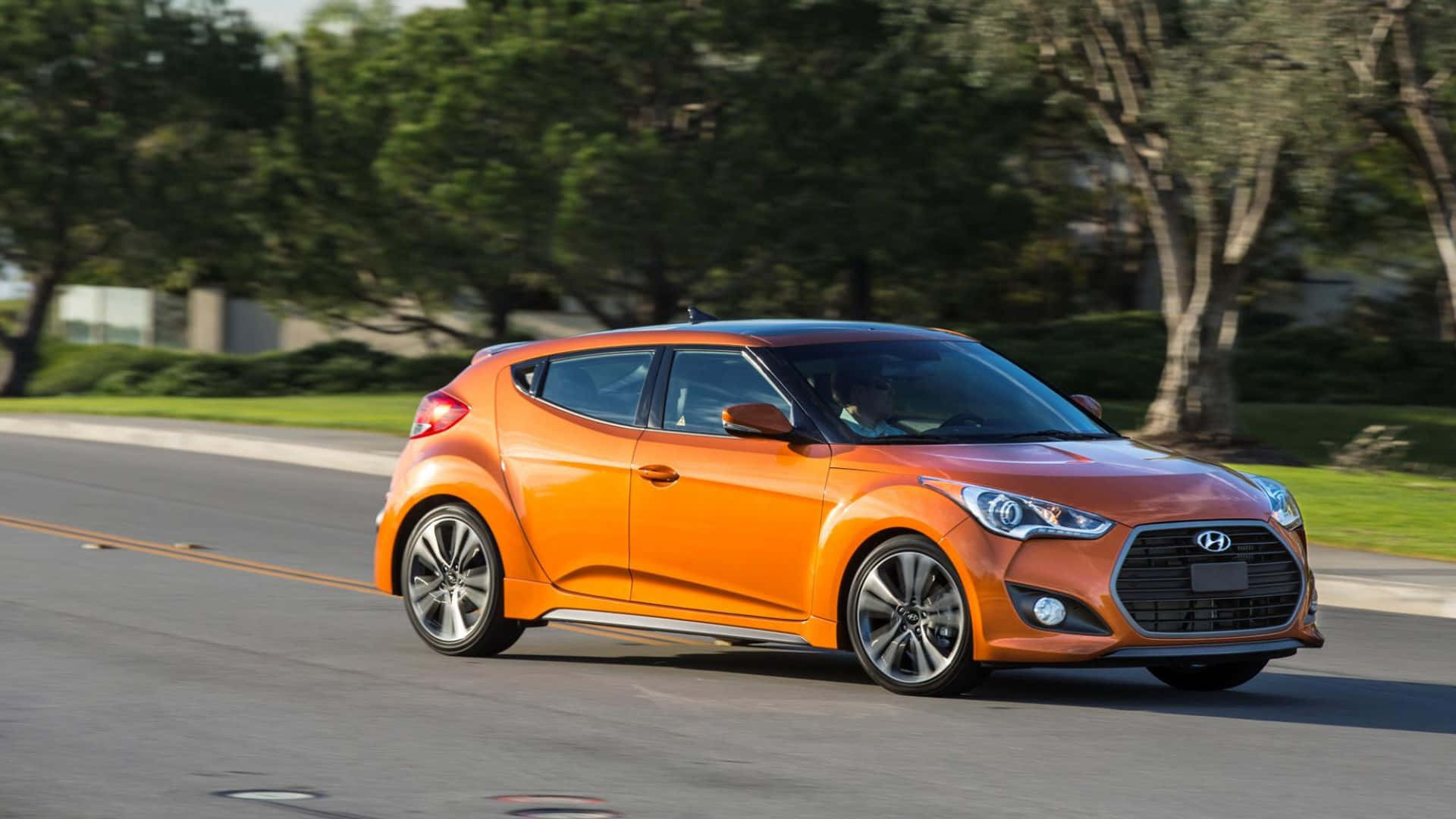 Hyundai Veloster, vibrant orange, tree-lined suburban road, Full HD Desktop Wallpaper