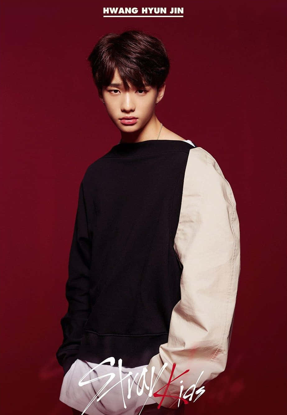 Hyunjin, black and beige color-block sweatshirt, deep red studio backdrop, HD Phone Wallpaper