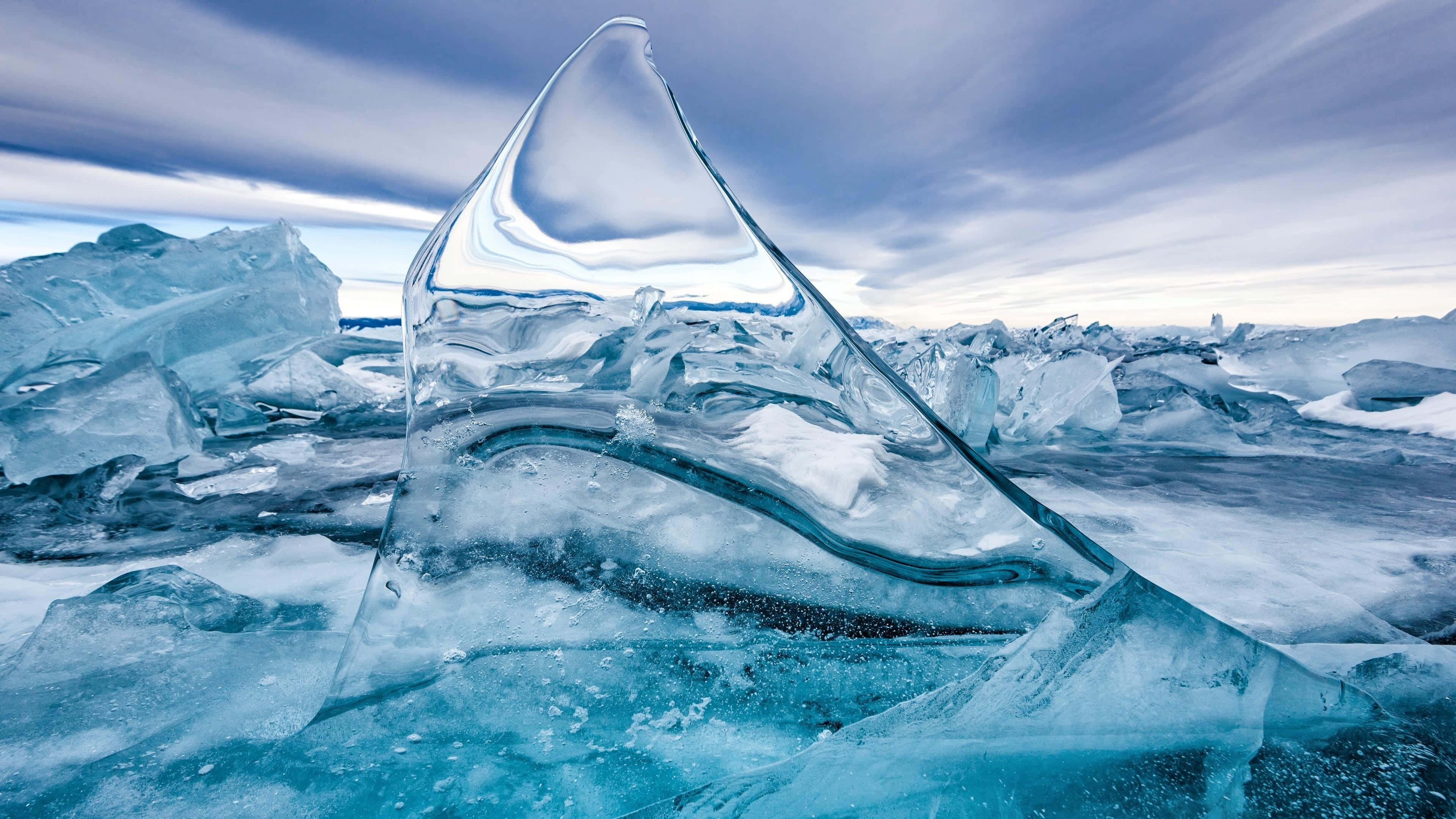 Ice Blue, translucent blue iceberg sculpture, streaked sky, 4K Desktop Wallpaper