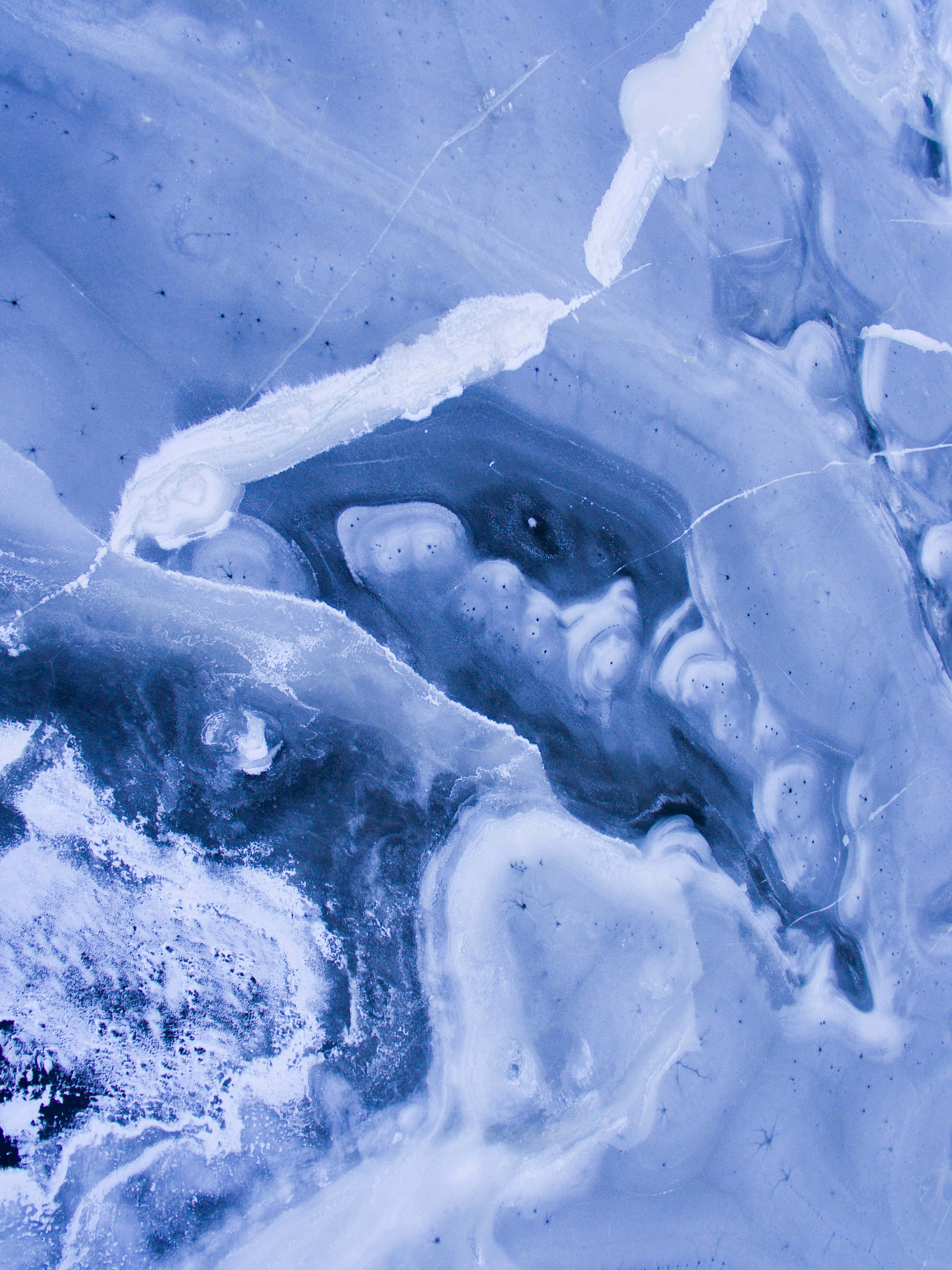 blue ice, swirling patterns, embedded air bubbles, 4K Phone Wallpaper