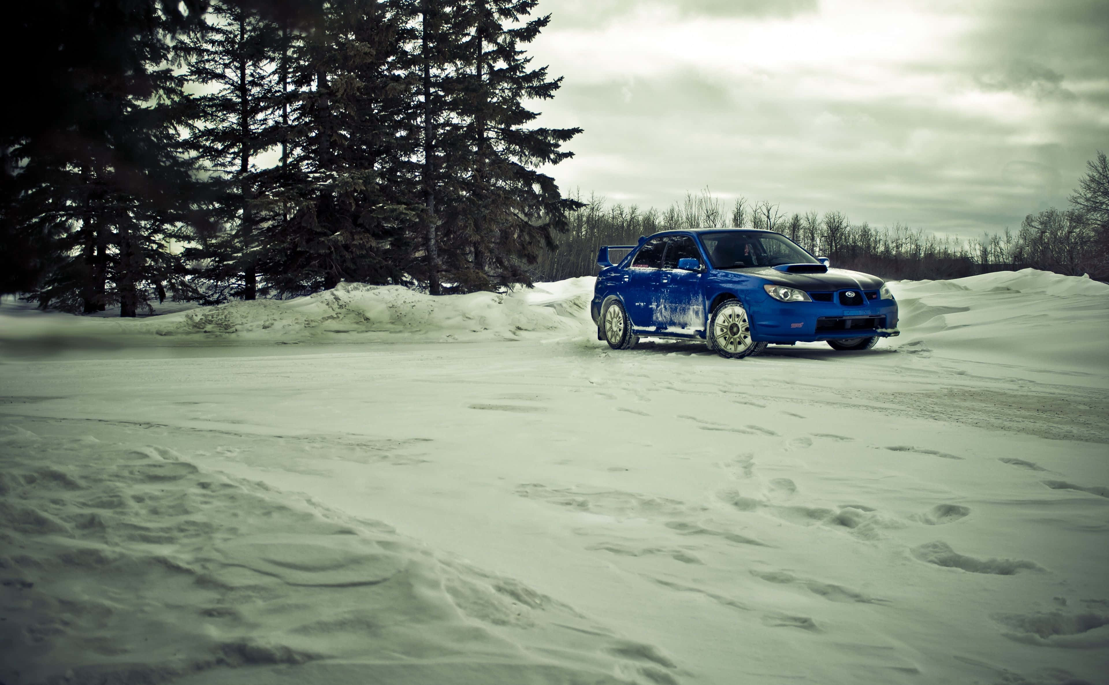 Ice Racing, vibrant blue rally car, frozen track, 2K Desktop Wallpaper