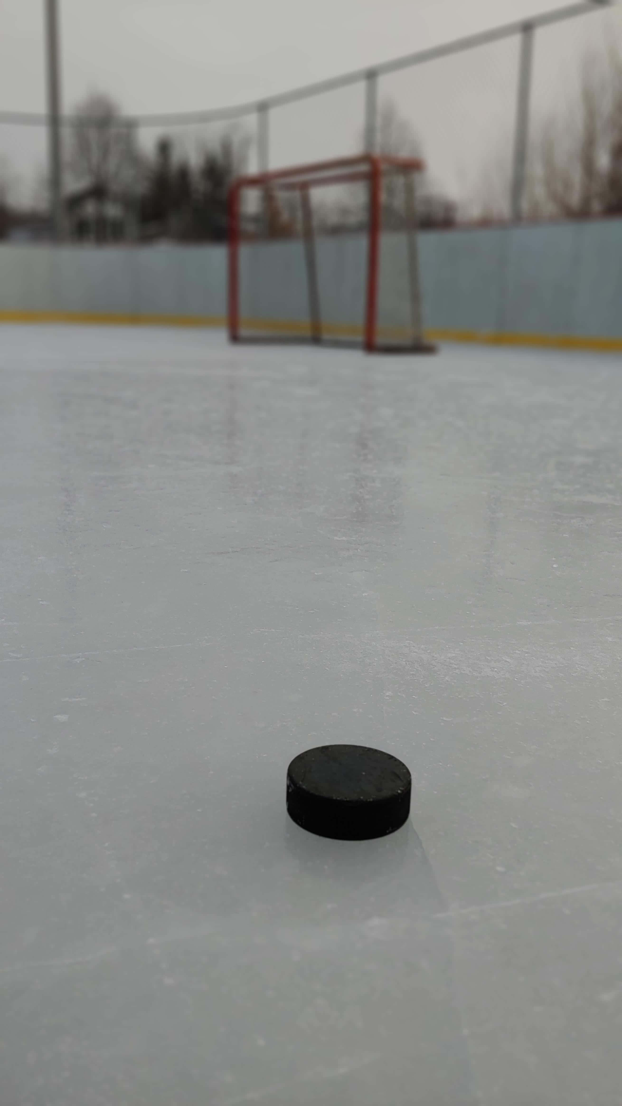 ice rink, black hockey puck, weathered ice rink, 4K Phone Wallpaper