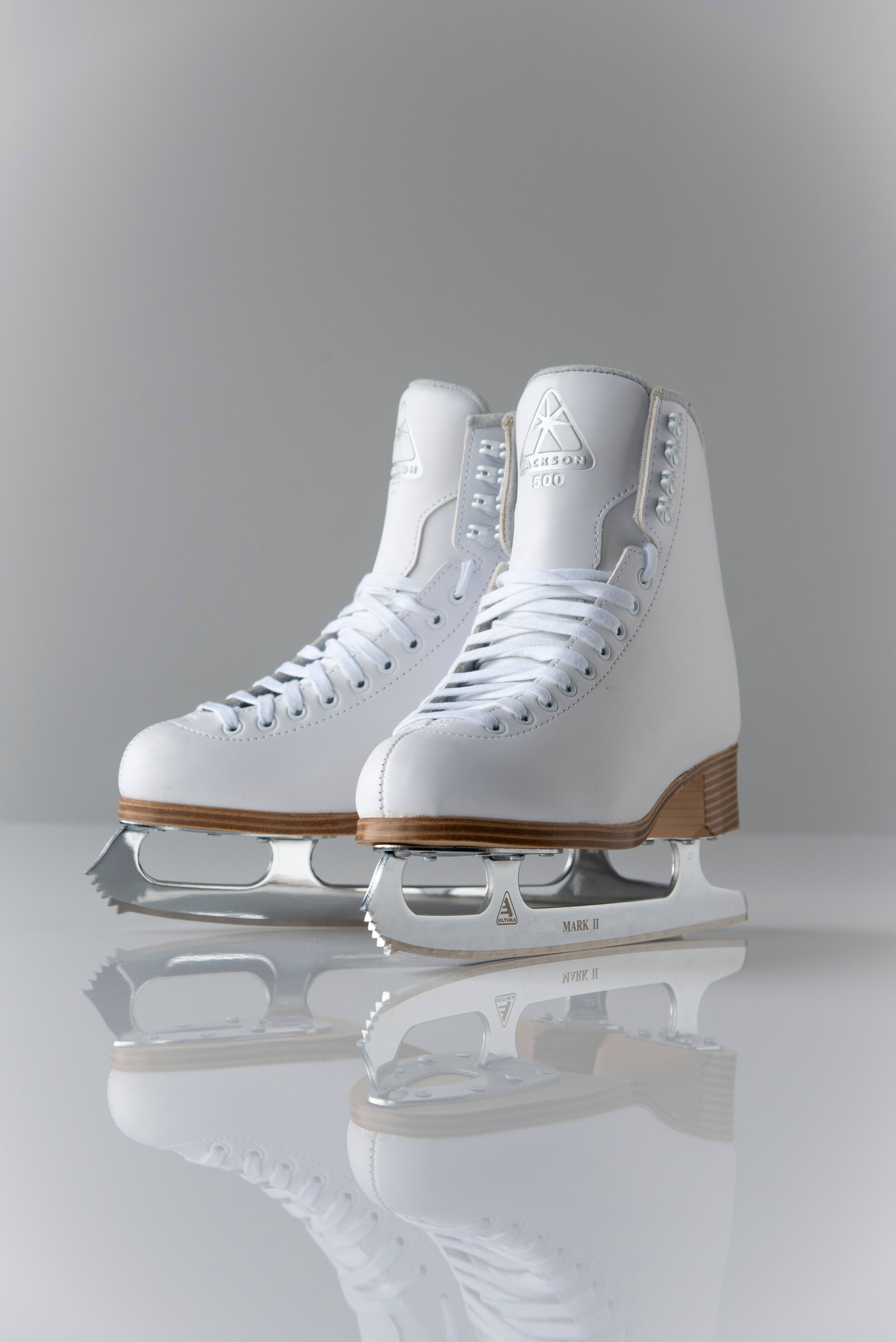 minimalist ice skating boots, pristine white figure skates, silver blades, 5K Phone Wallpaper