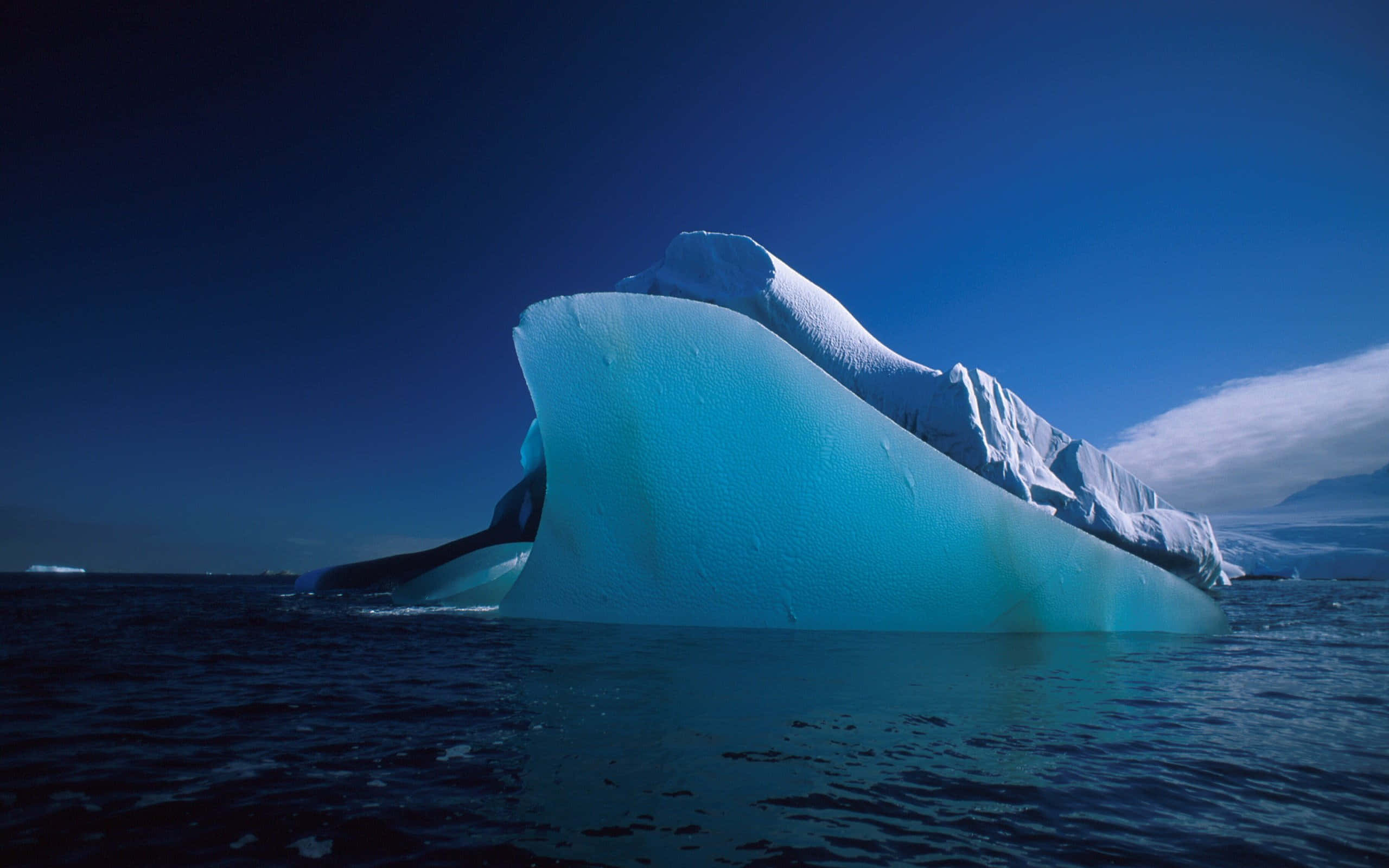 Iceberg, glowing blue ice, pristine ocean, 2K Desktop Wallpaper