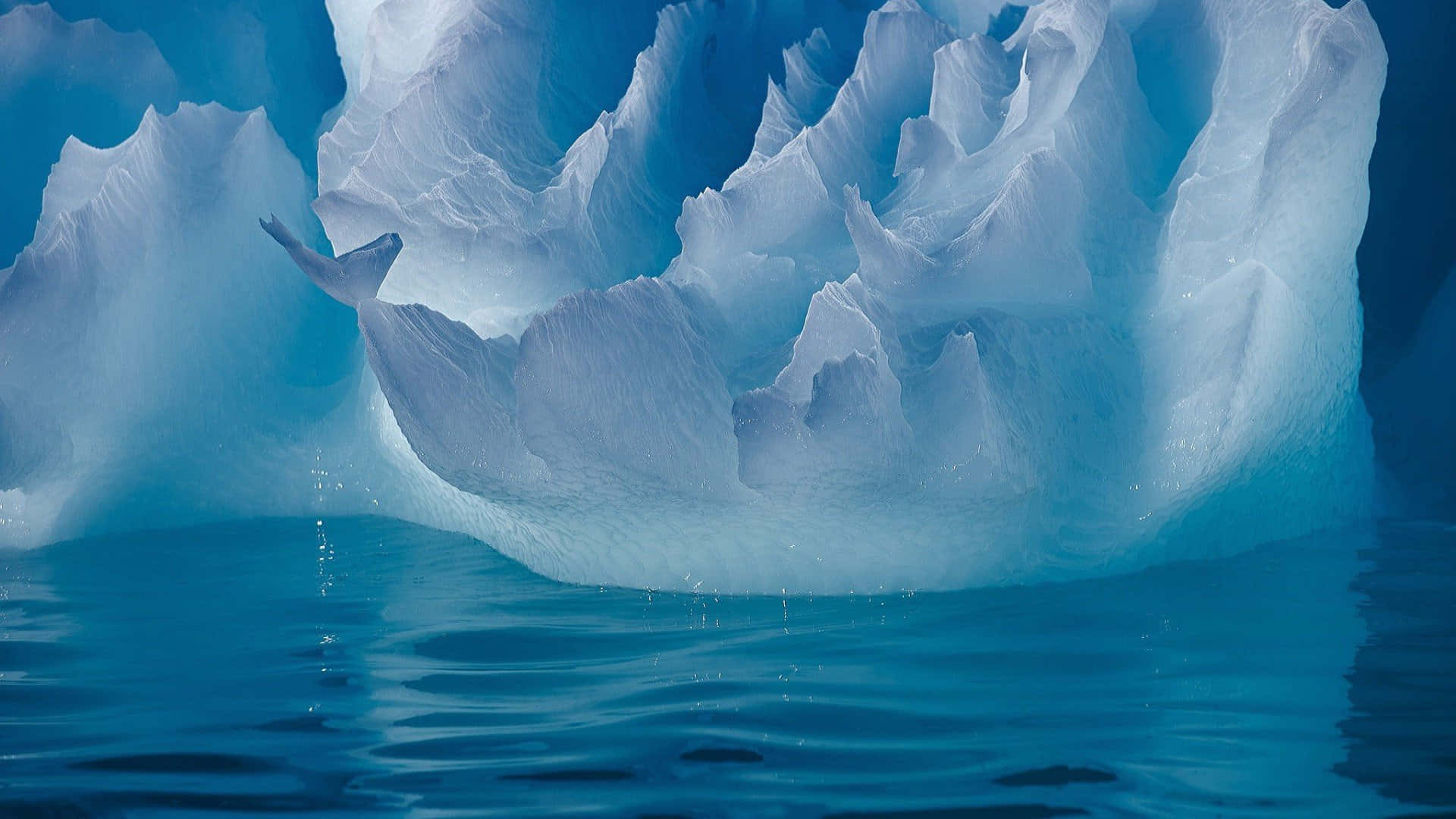 Iceberg, blue-white peaks, deep turquoise water, Full HD Desktop Wallpaper