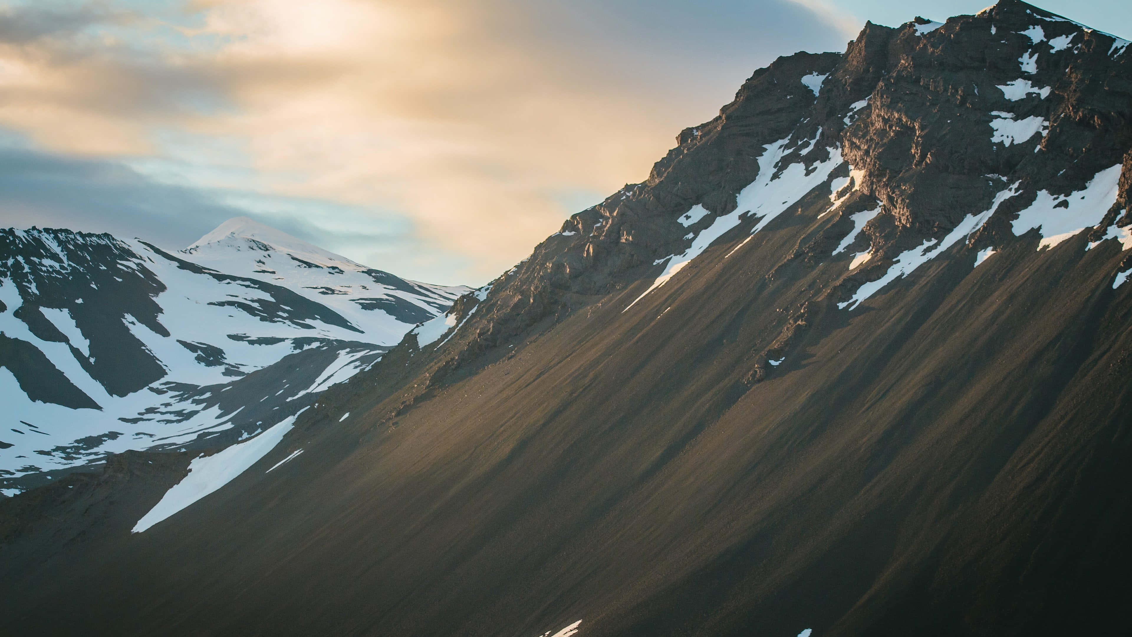 Iceland, snow-dusted mountain peaks, golden warmth, 4K Desktop Wallpaper