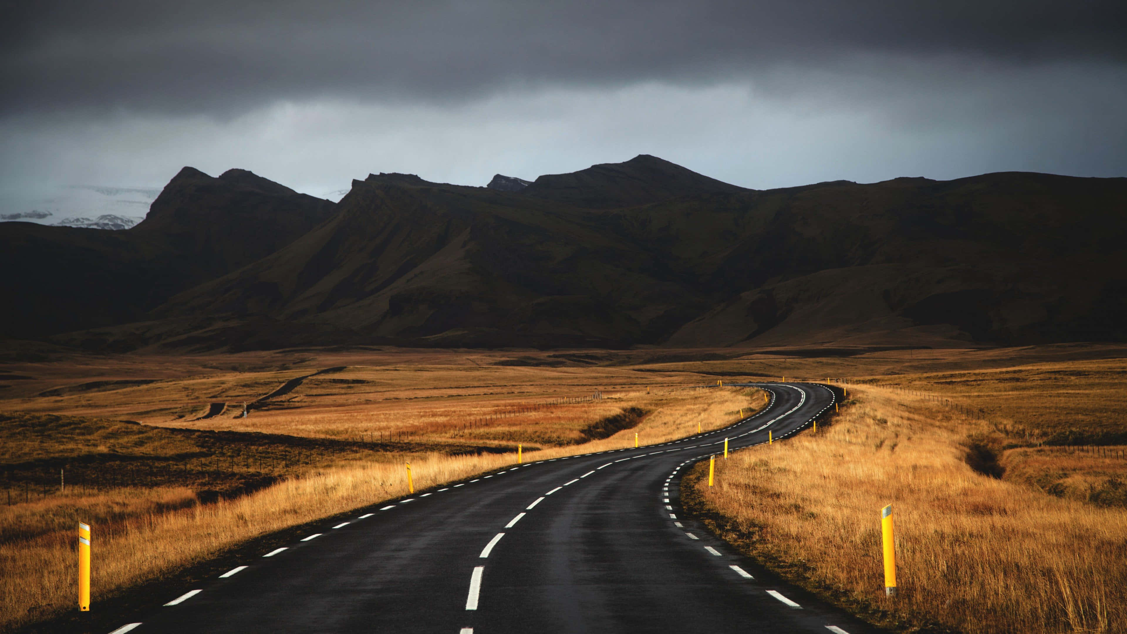 Iceland, asphalt road, golden grasslands, 4K Desktop Wallpaper