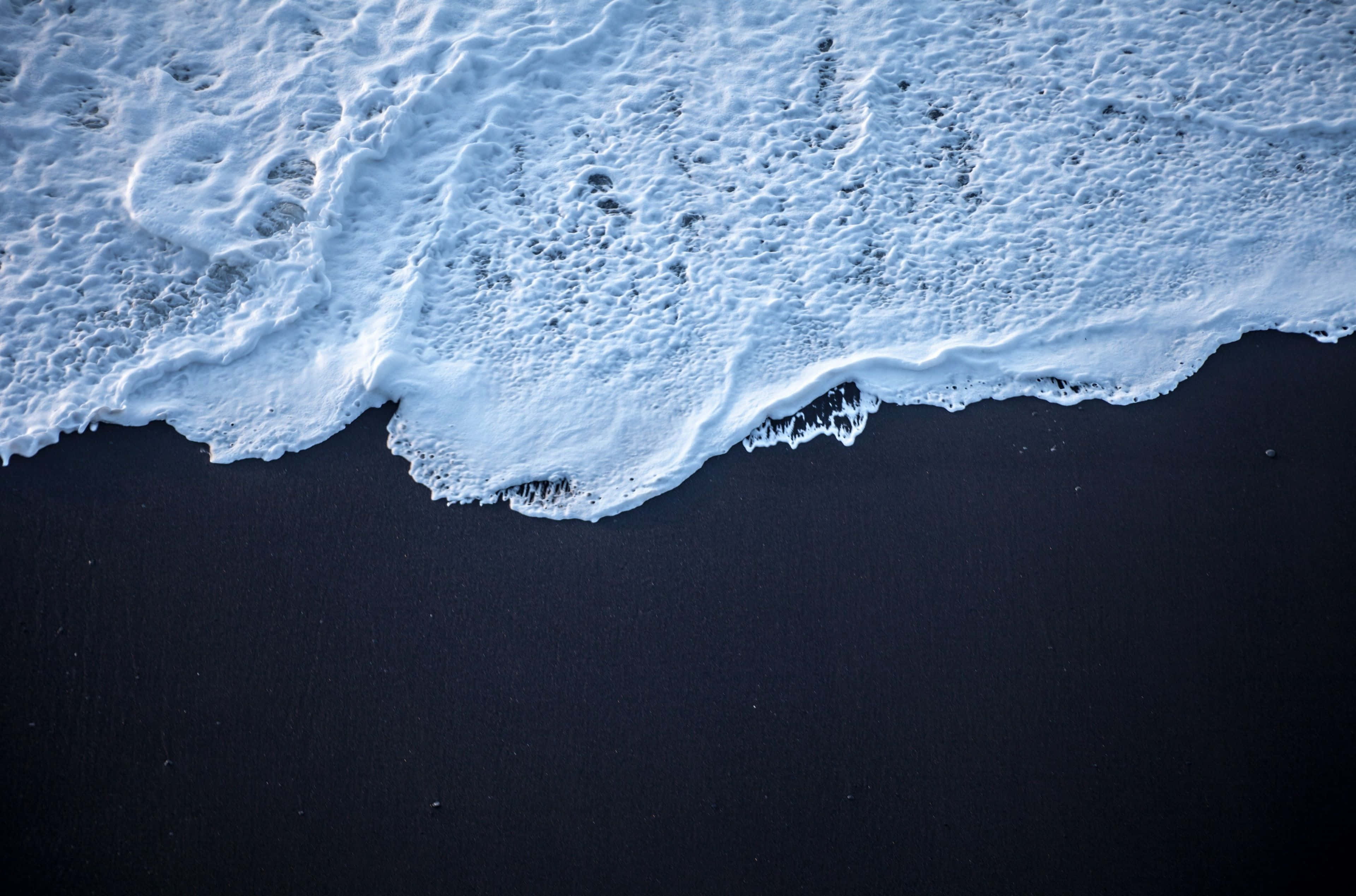 Iceland Desktop, foamy ocean waves, stark black volcanic beach, 4K Desktop Wallpaper