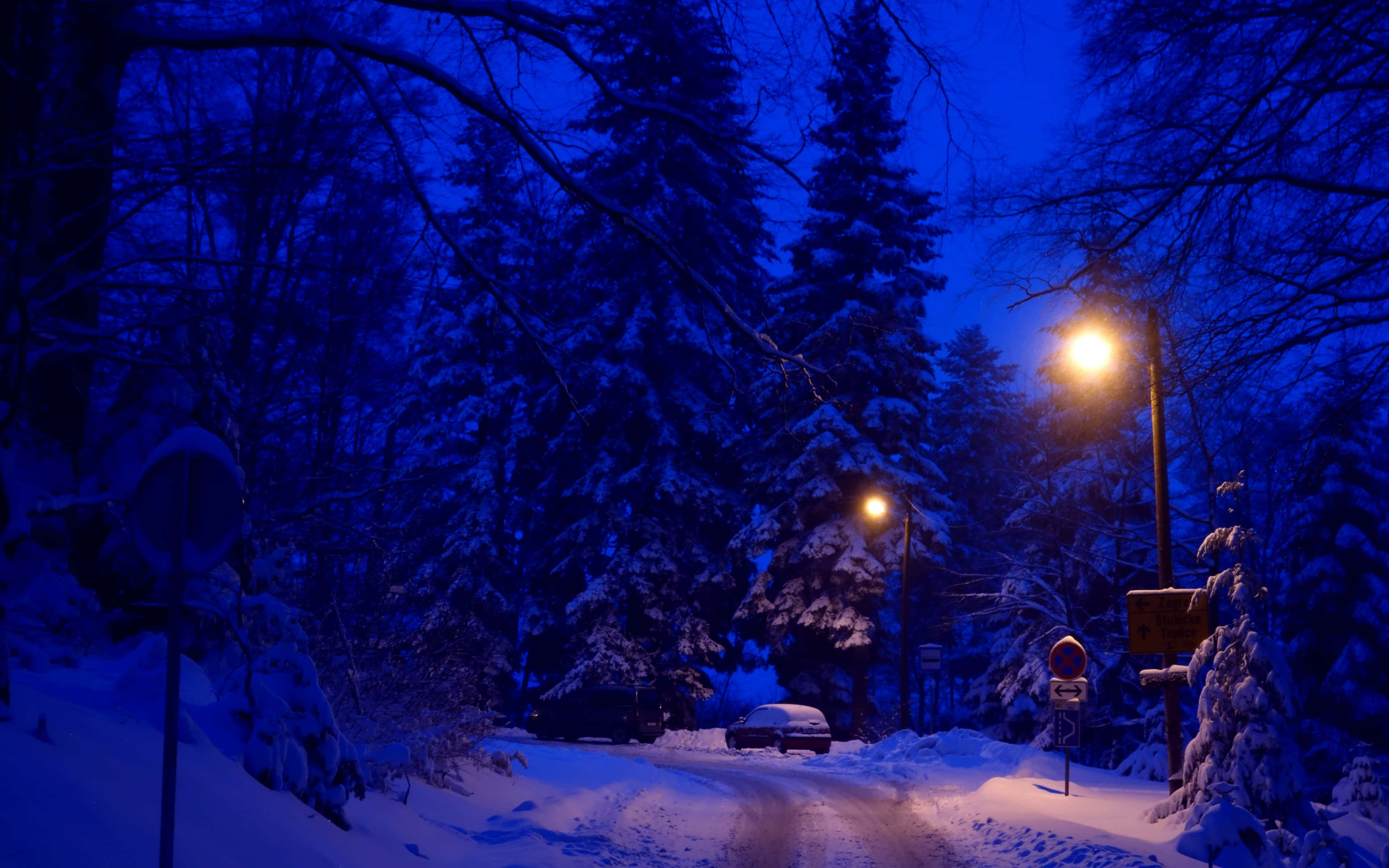 Night Street, snow-covered road, warm streetlights, 4K Desktop Wallpaper