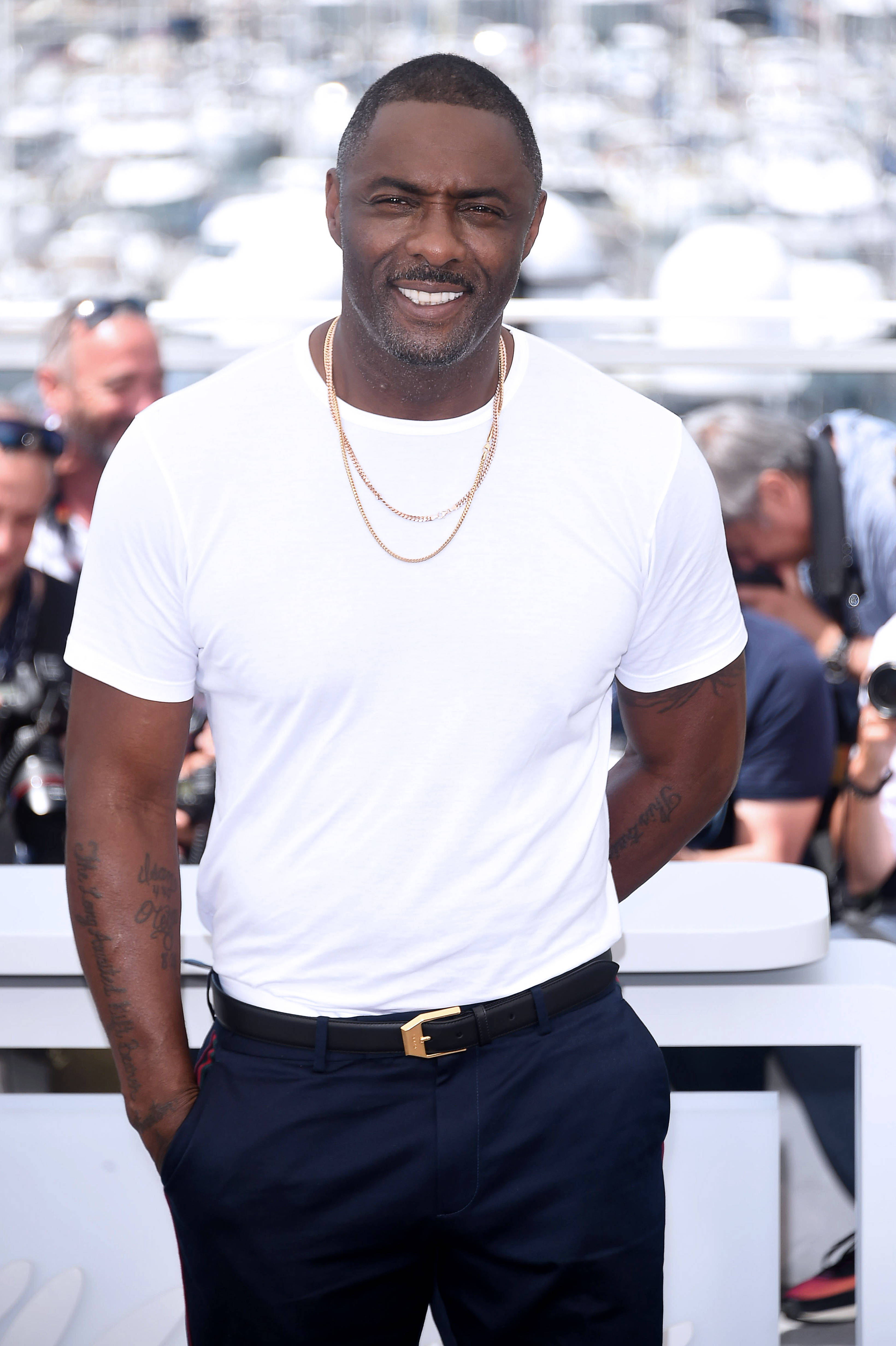 Idris Elba, white t-shirt, navy pants, 4K Phone Wallpaper