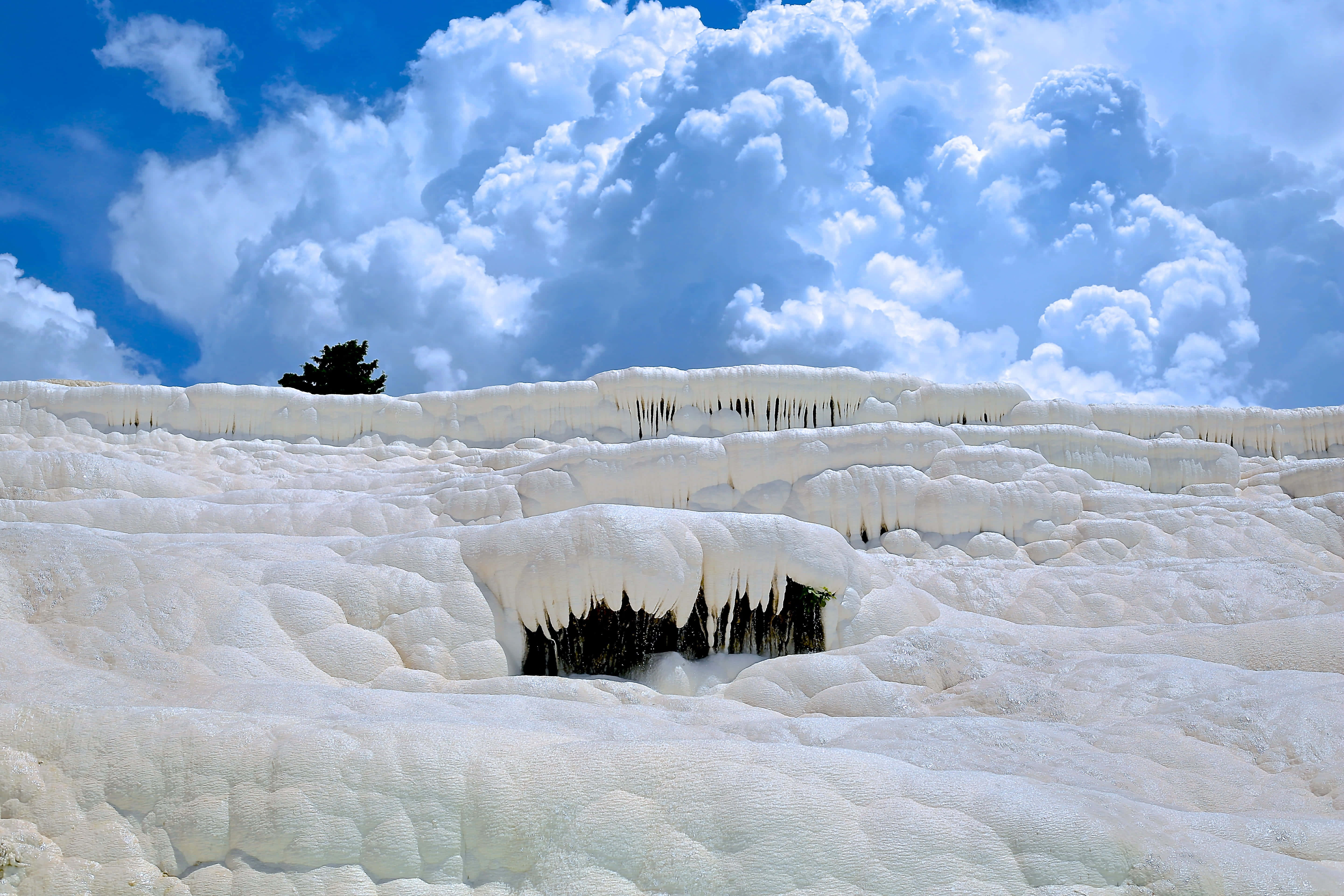 Idyllic Snow, white terraced travertine pools, bright blue sky, 5K Desktop Wallpaper