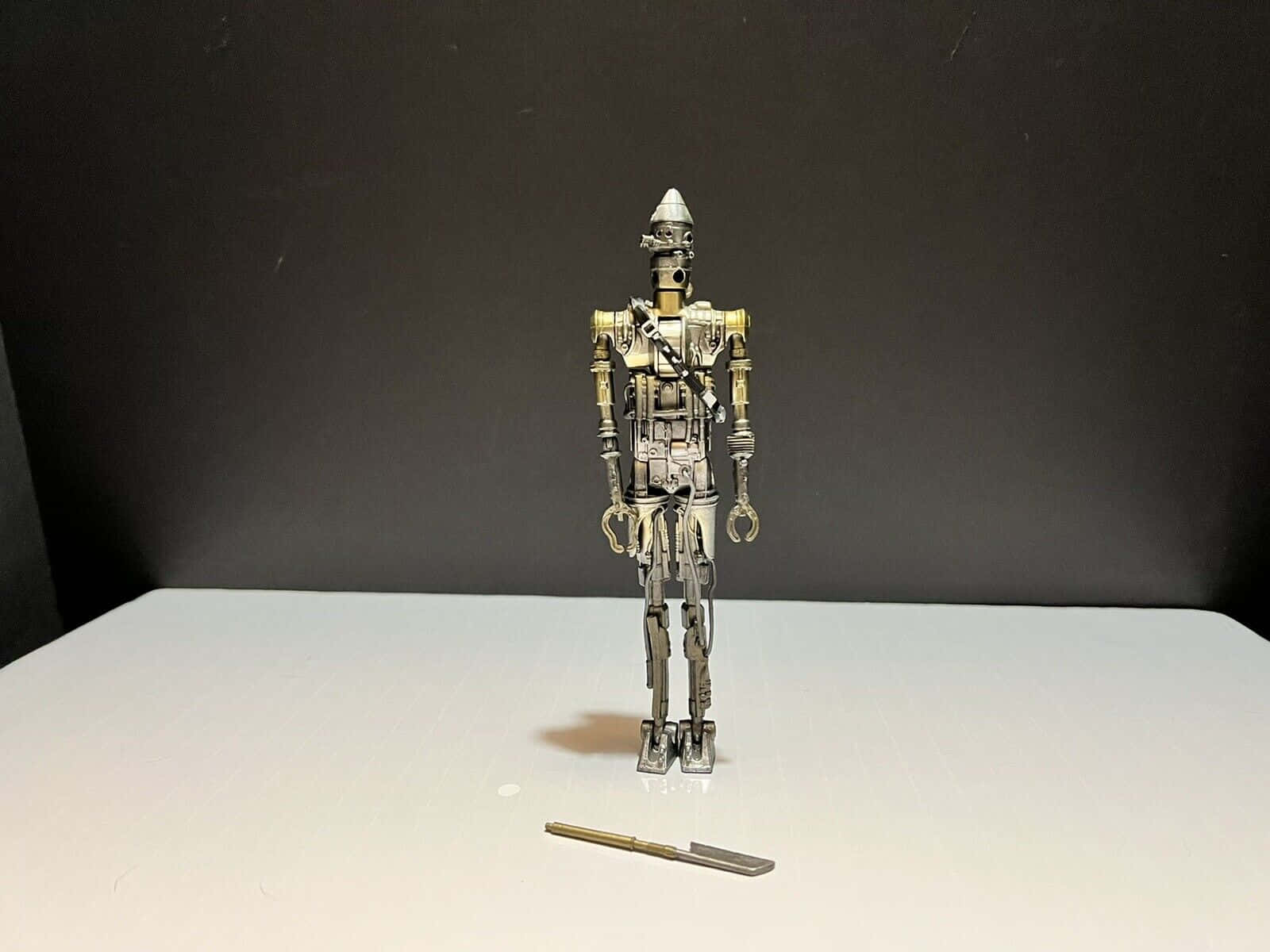 IG-88, metallic robot figurine, white surface, HD Desktop Wallpaper
