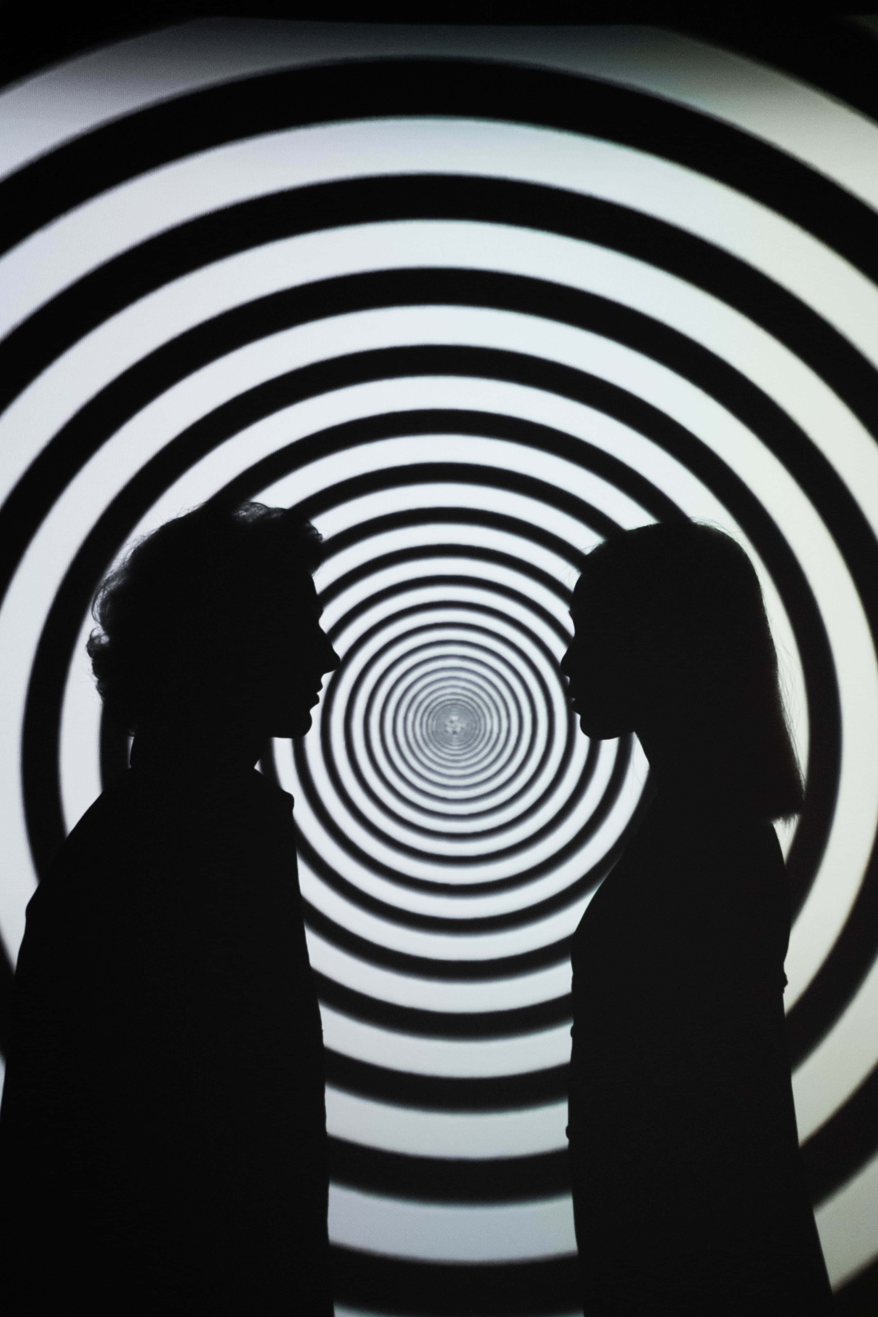 black and white spiral tunnel, silhouetted figures, Couple, 5K Phone Wallpaper