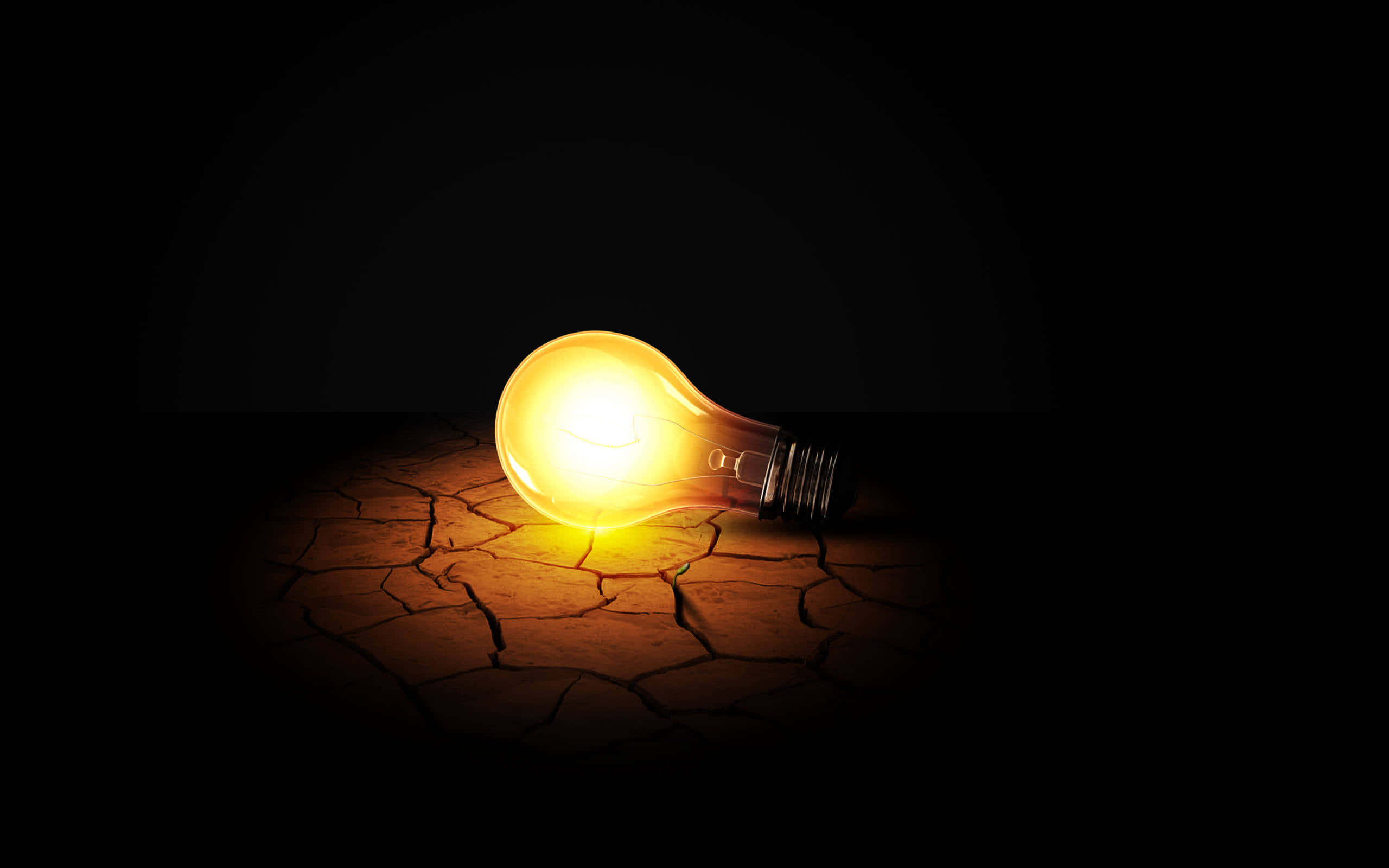 incandescent bulb, cracked ground, glowing, 2K Desktop Wallpaper