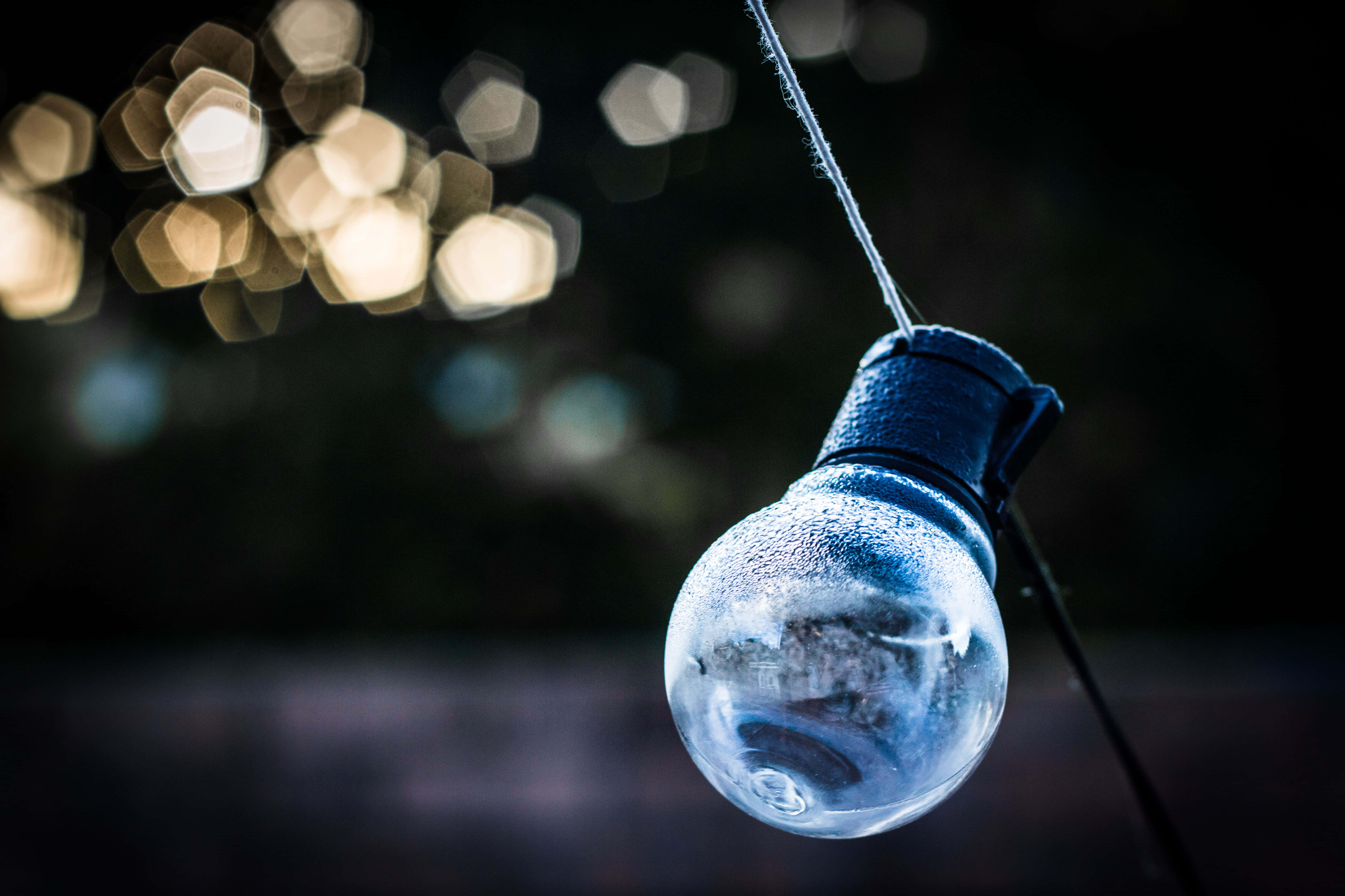 wet incandescent bulb, frost-covered string light, warm bokeh lights, 5K Desktop Wallpaper