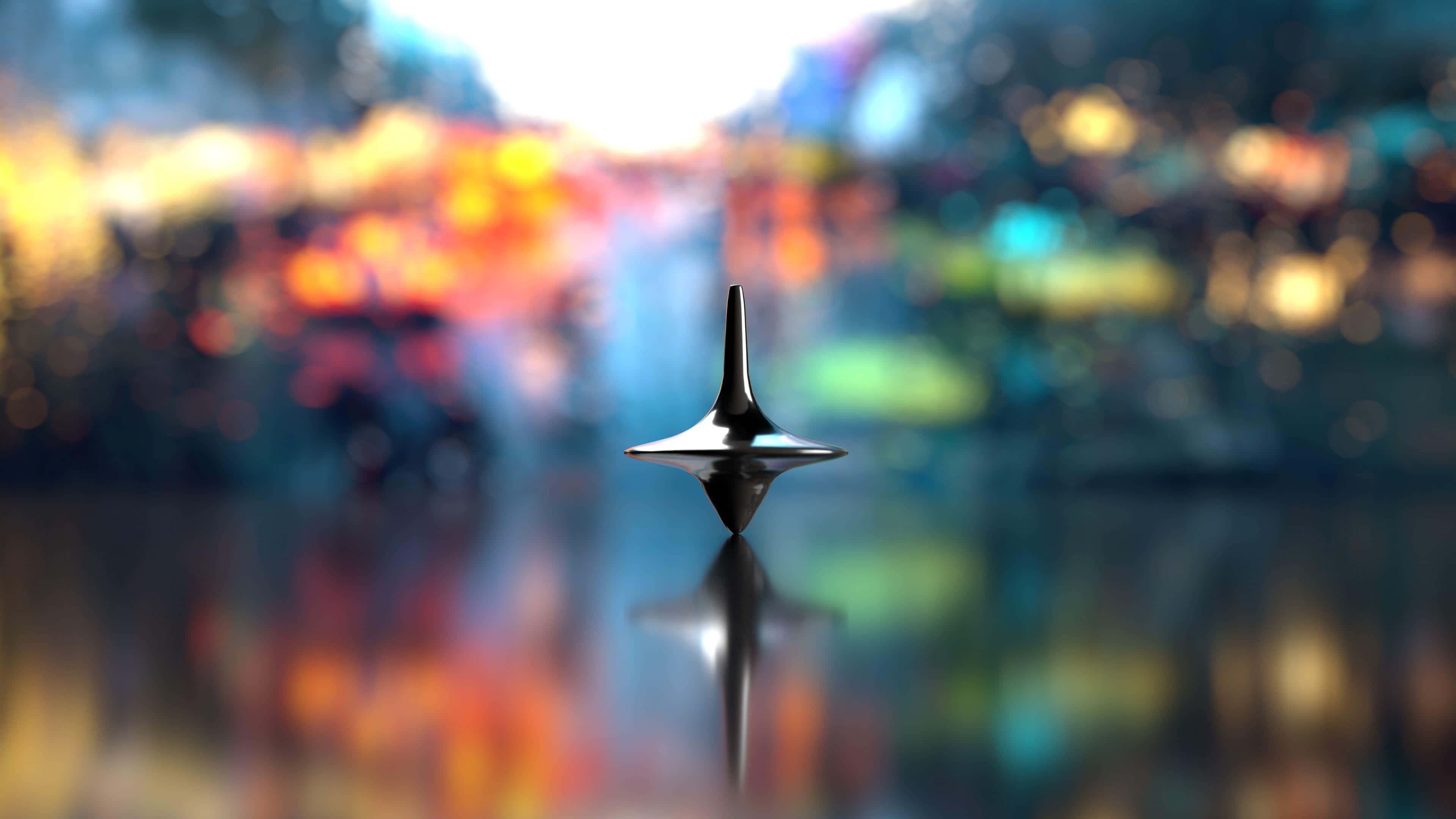 spinning top, reflective surface, vibrant bokeh cityscape, 4K Desktop Wallpaper
