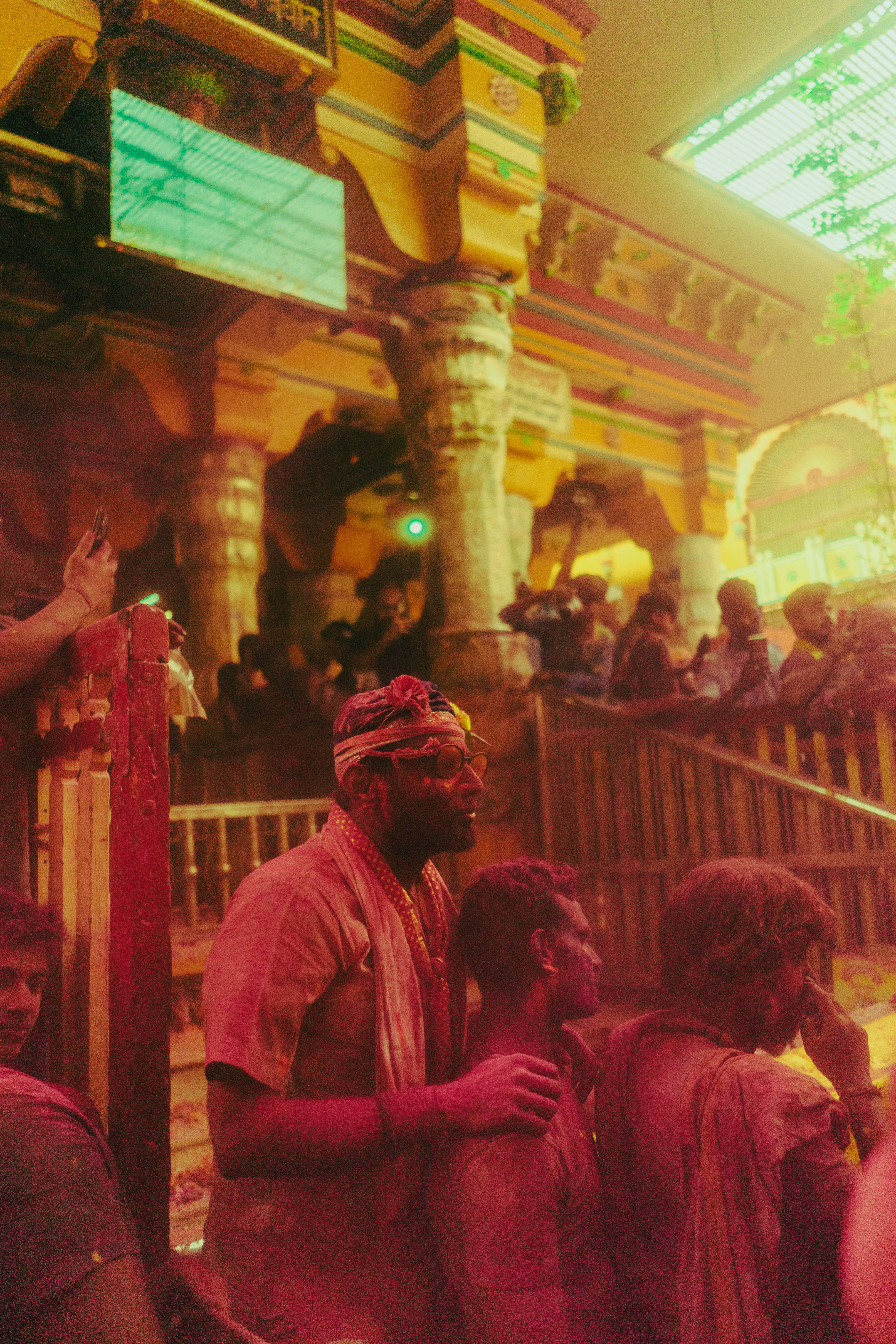India Holi, vibrant colored powder, brightly lit temple, 5K Phone Wallpaper
