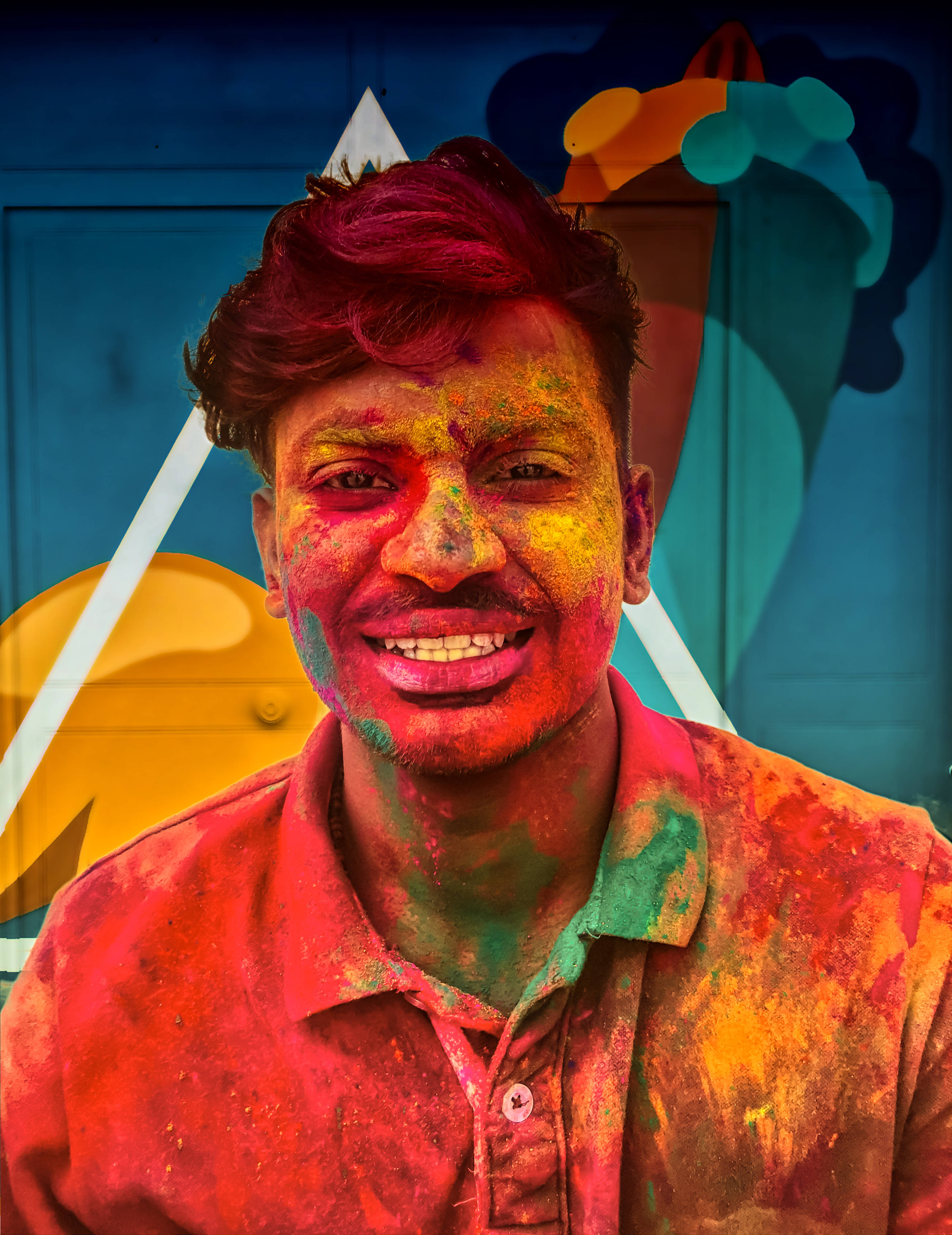India Holi, vibrant colored powder, blue background, 4K Phone Wallpaper