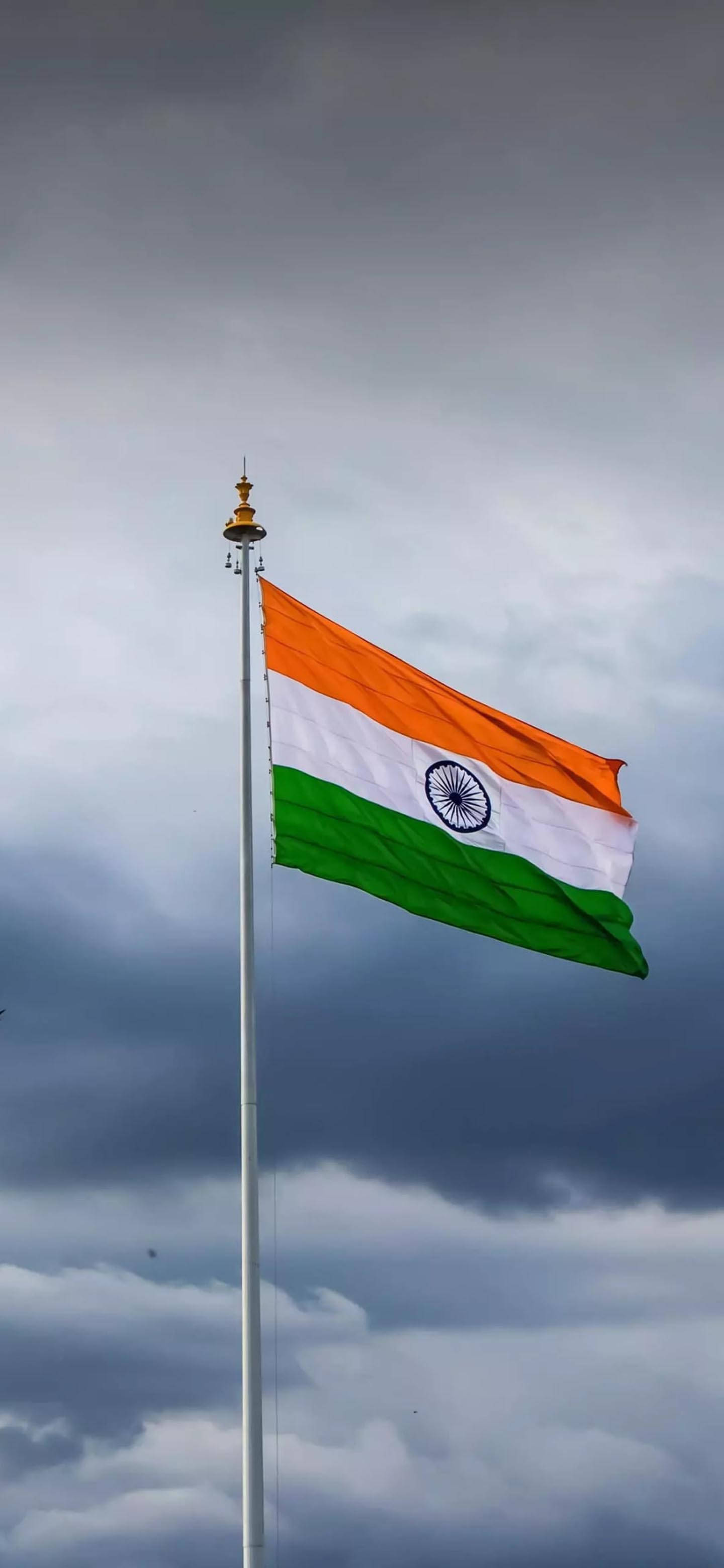 India flag, overcast sky, dark storm clouds, 2K Phone Wallpaper