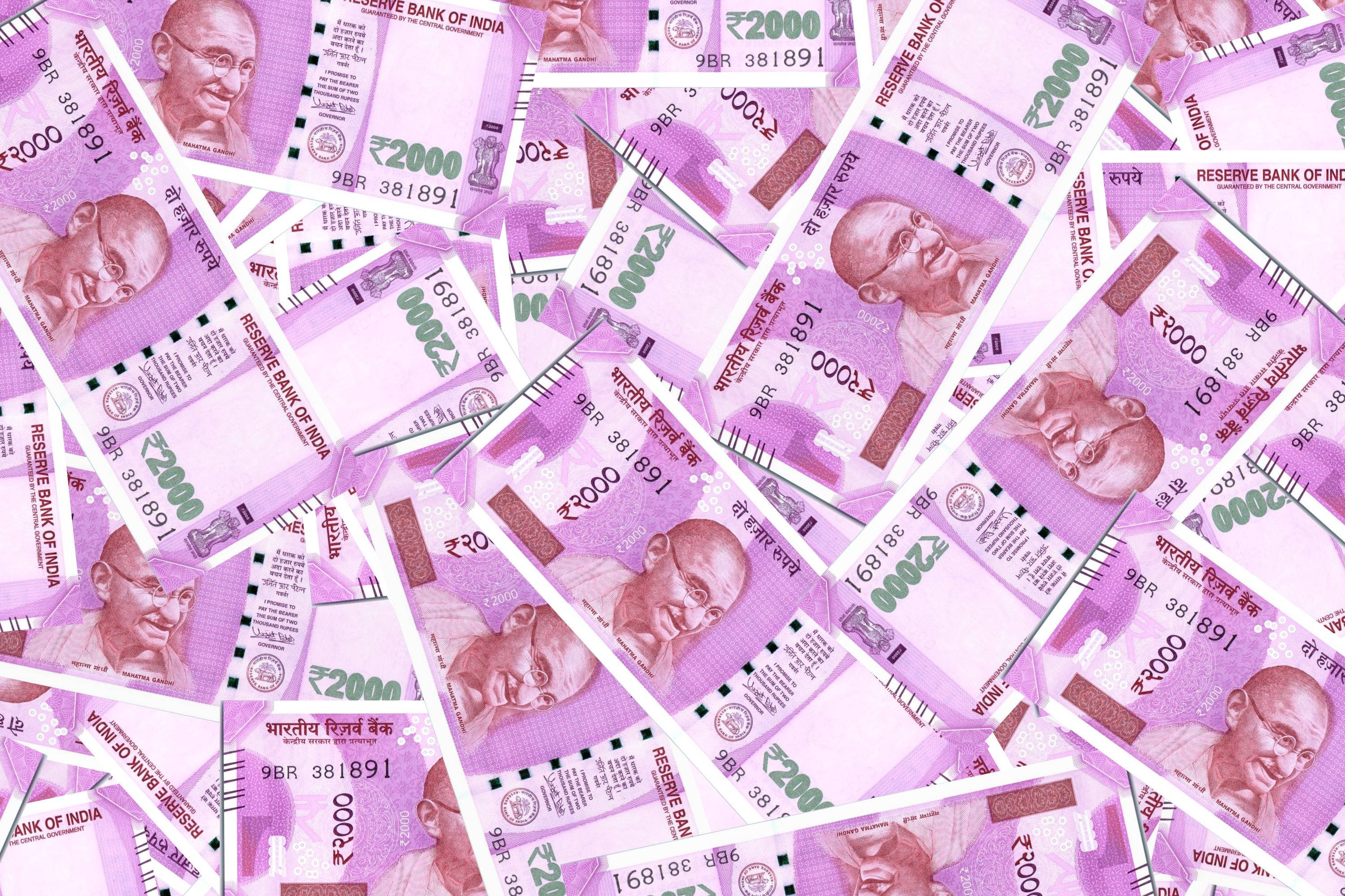 Indian 2000 rupee banknotes, vibrant purple, white background, 2K Desktop Wallpaper