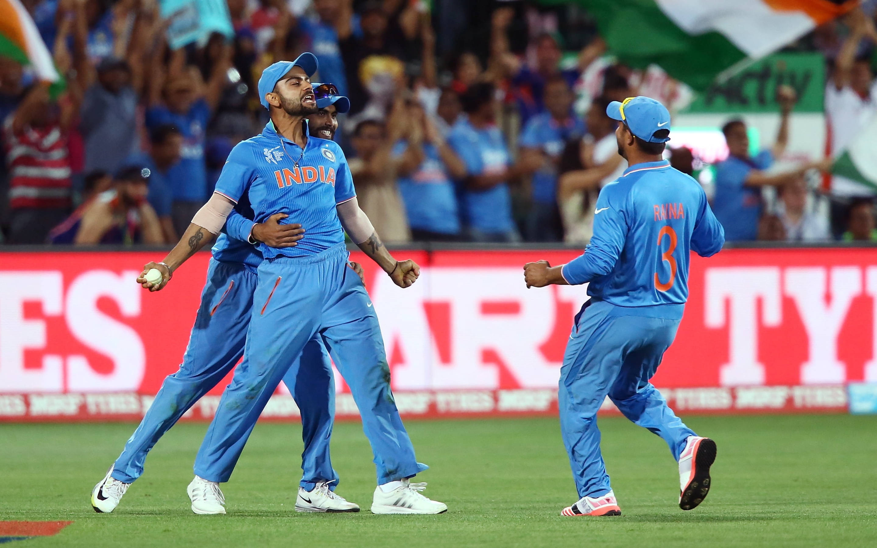 Indian Cricket Team, blue uniforms, vibrant green field, 2K Desktop Wallpaper
