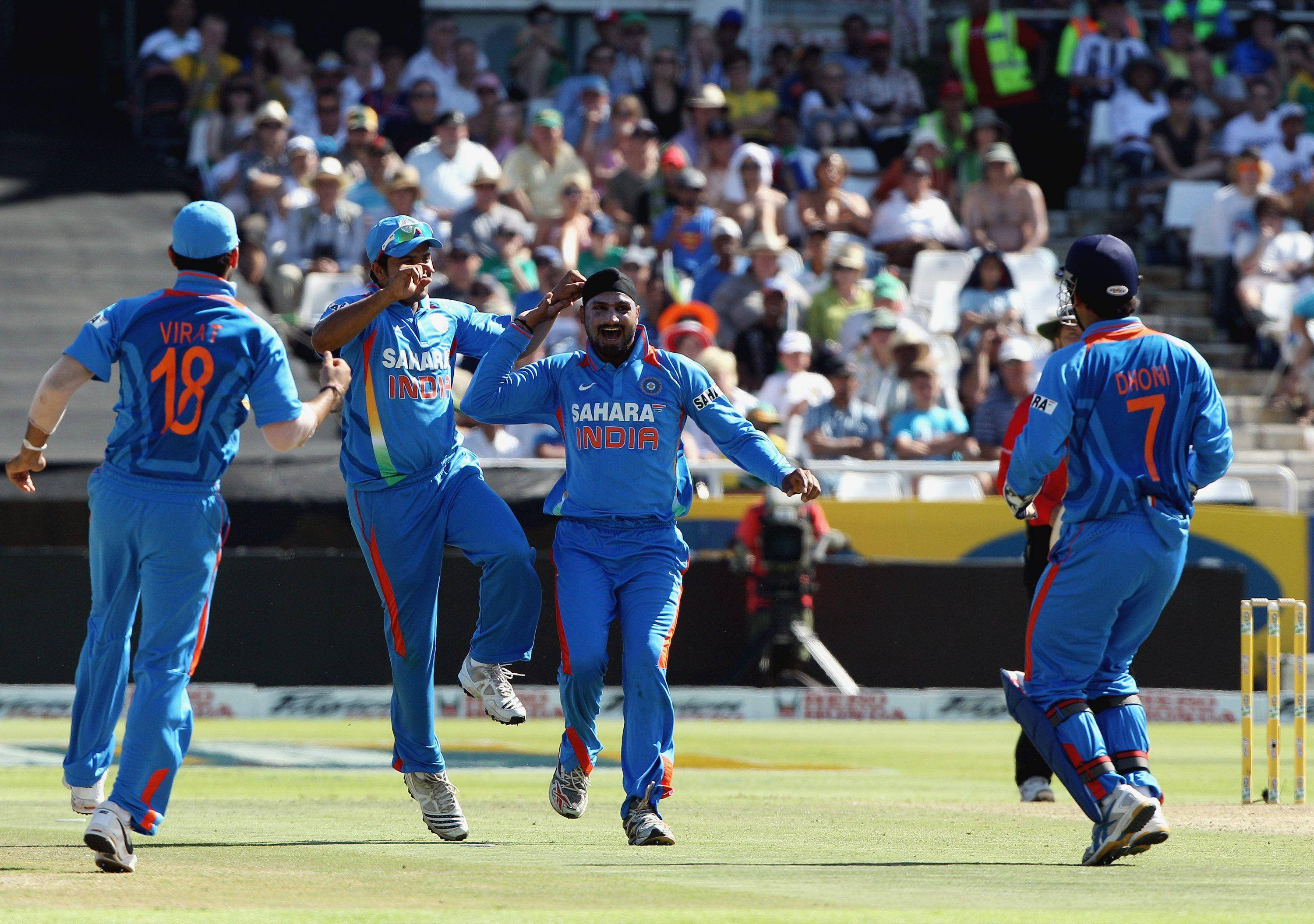 Indian Cricket Team, blue uniforms, sunlit green field, 2K Desktop Wallpaper