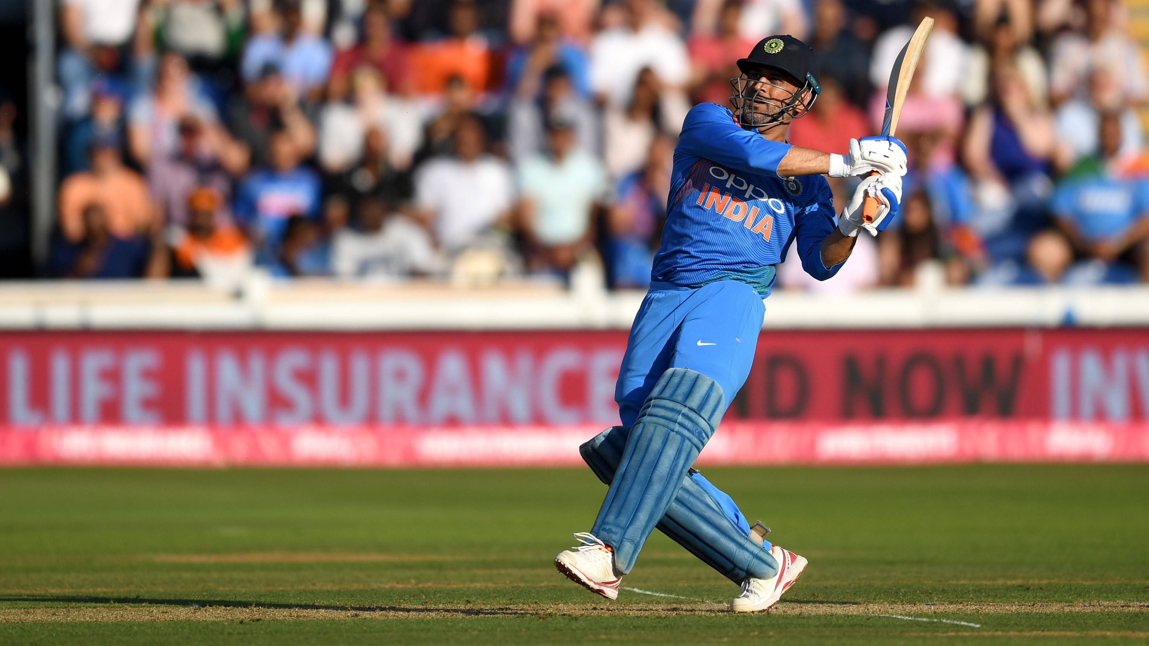 Indian Cricket player, blue uniform, sunlit green field, 4K Desktop Wallpaper
